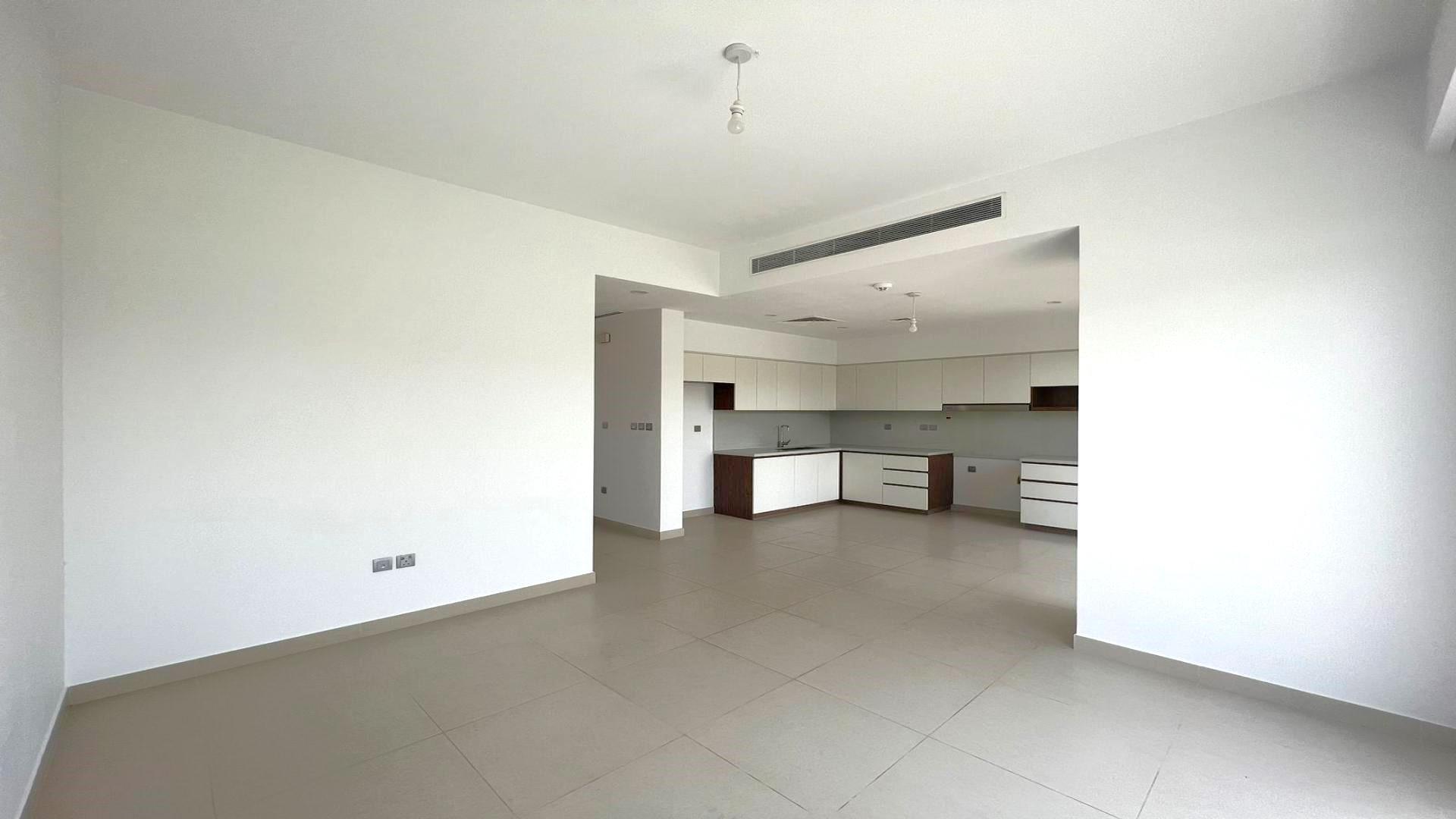 Modern kitchen and living area in 3-bedroom villa, Camelia, Arabian Ranches 2 townhouse