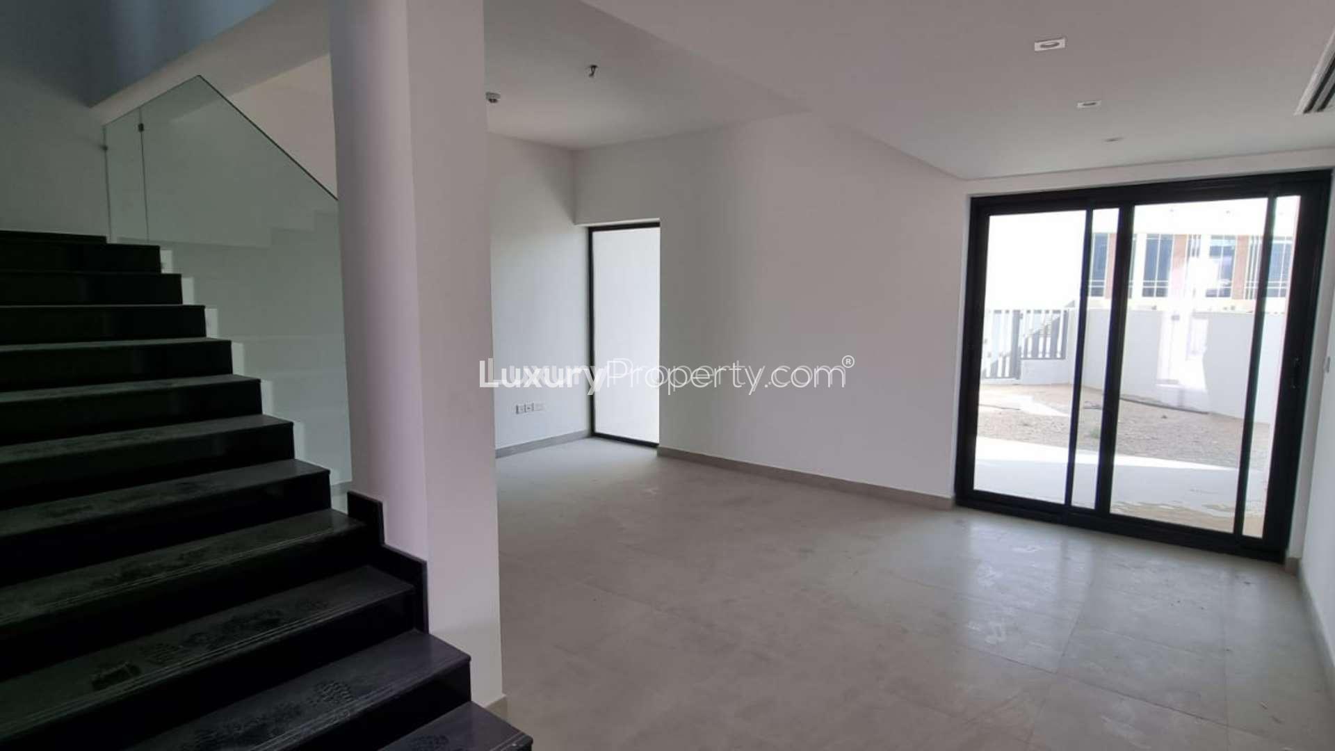 Row of modern townhouses in Rukan 2, Dubai Land, available for rent