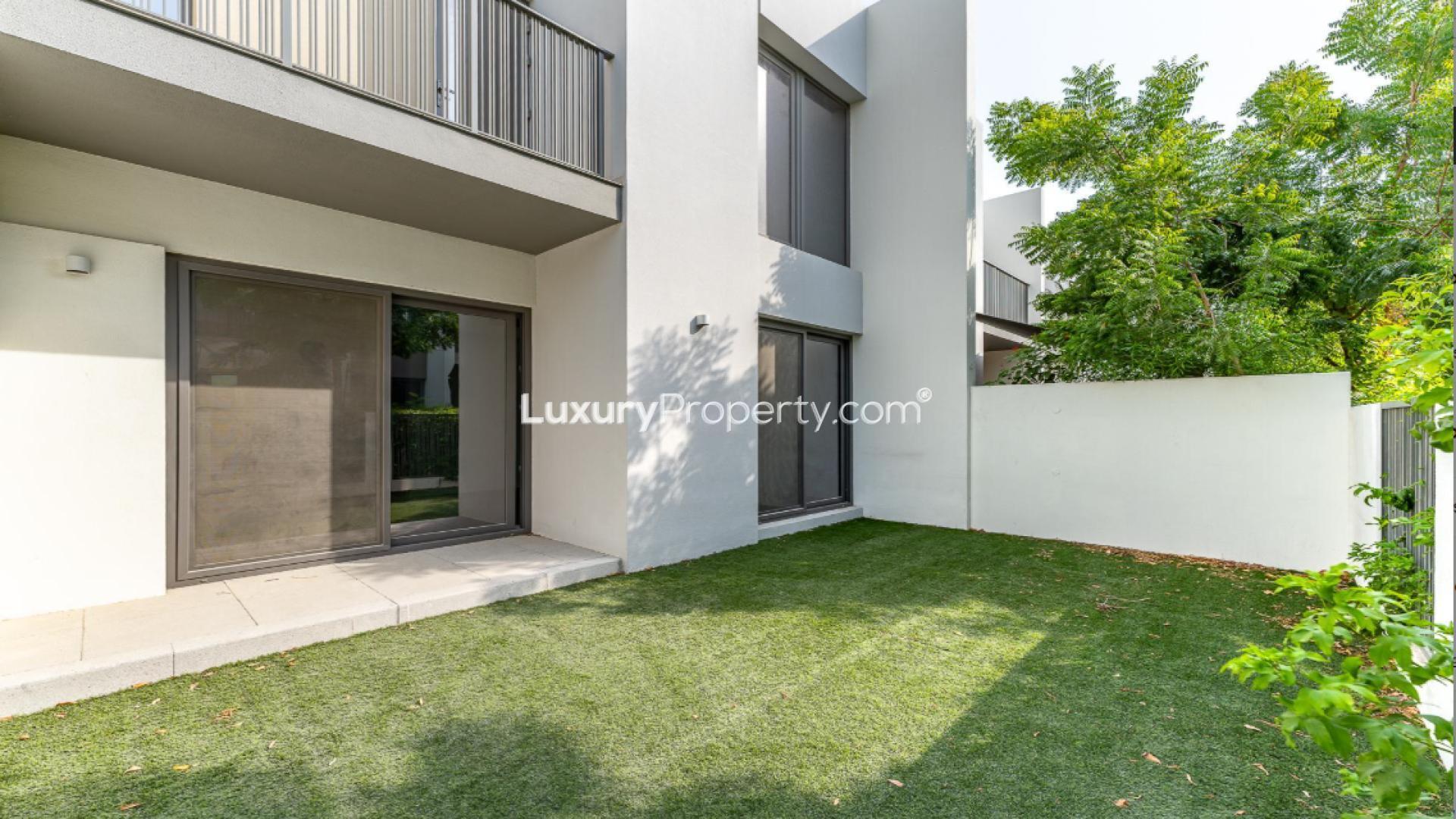 Bright living area with garden view in Tilal Al Ghaf townhouse for rent
