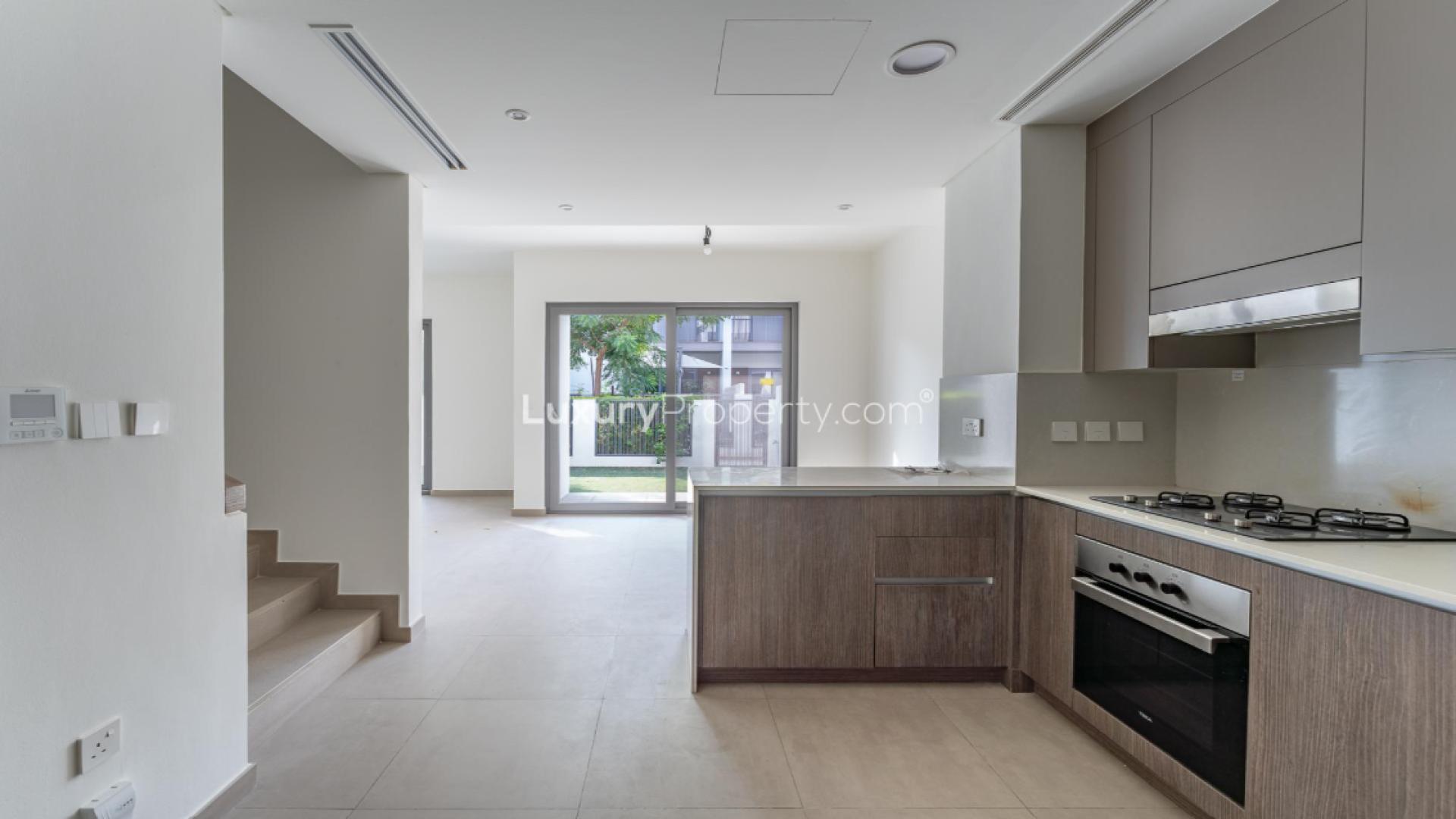 Tilal Al Ghaf Elan 2 townhouse exterior, prime location, spacious driveway, modern design