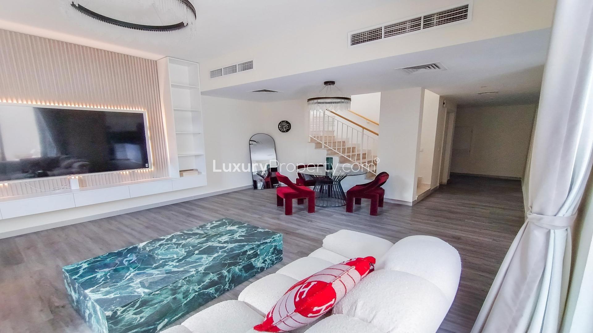 Modern living room in Maple 2 townhouse, Dubai Hills Estate, with stylish decor and furniture