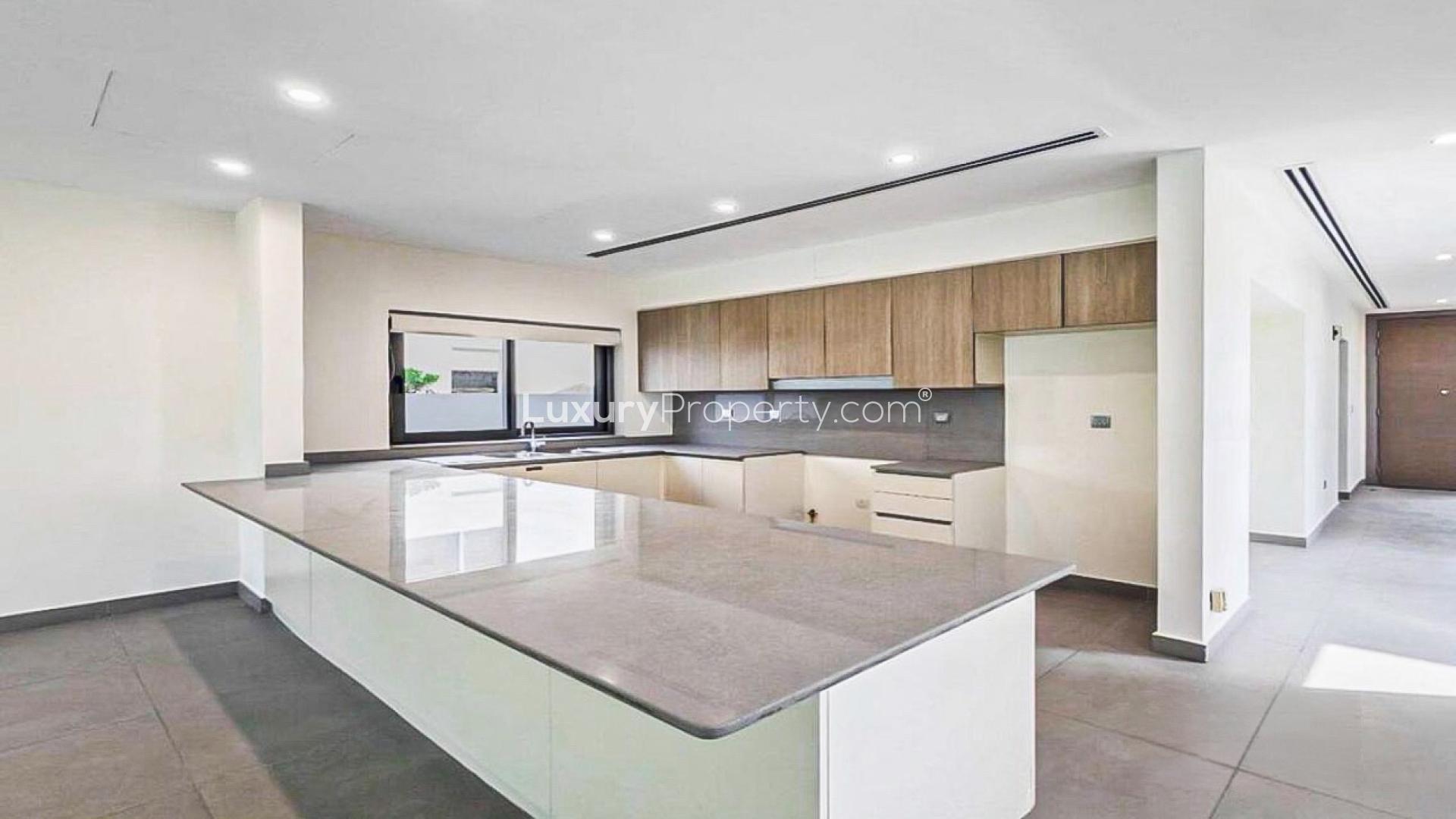 Modern open-plan kitchen and living area in Sidra Villas 2 townhouse, Dubai Hills Estate
