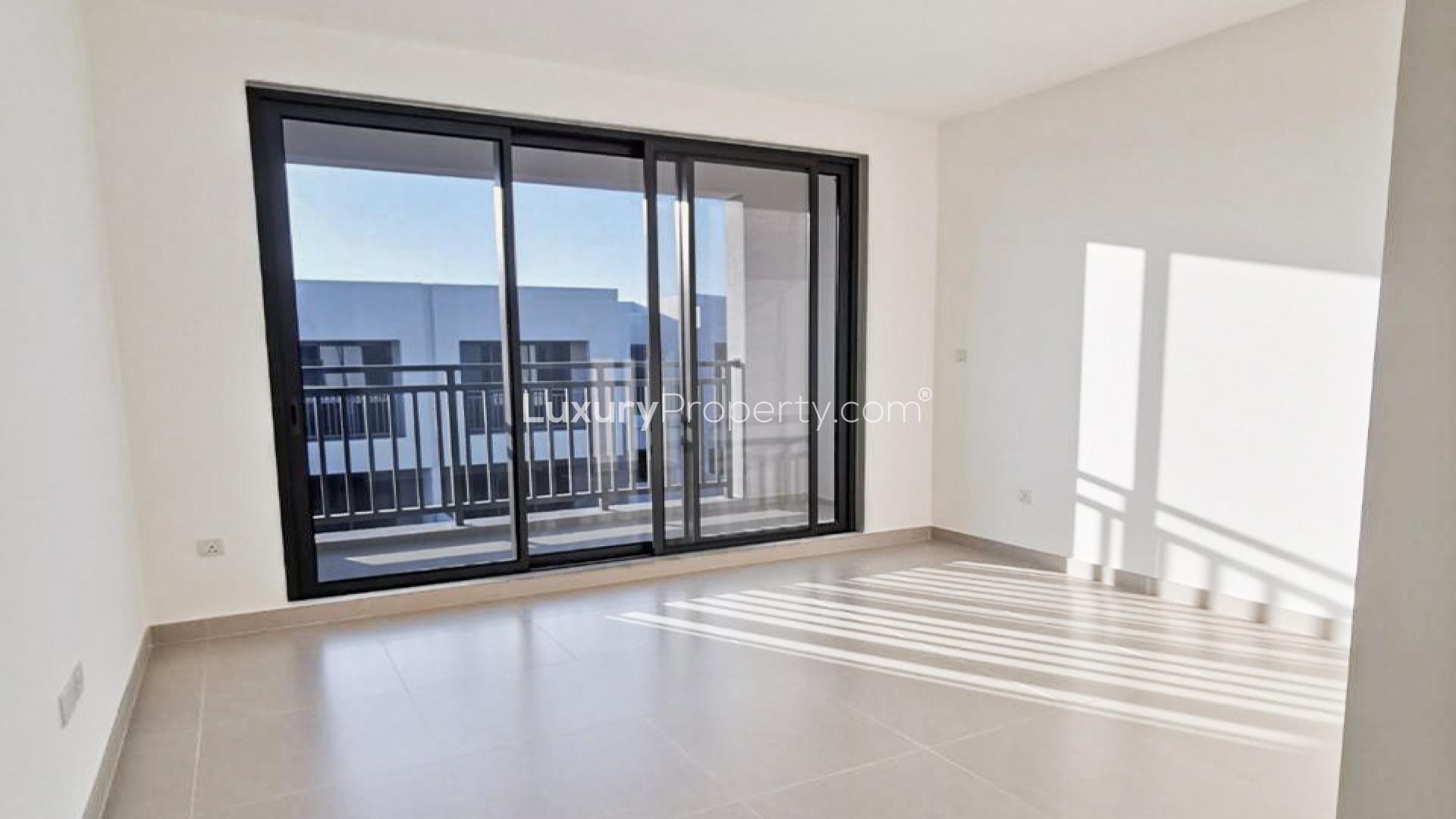 Spacious living room in 3BR townhouse, Maple 3, Dubai Hills Estate, large windows, tiled floor