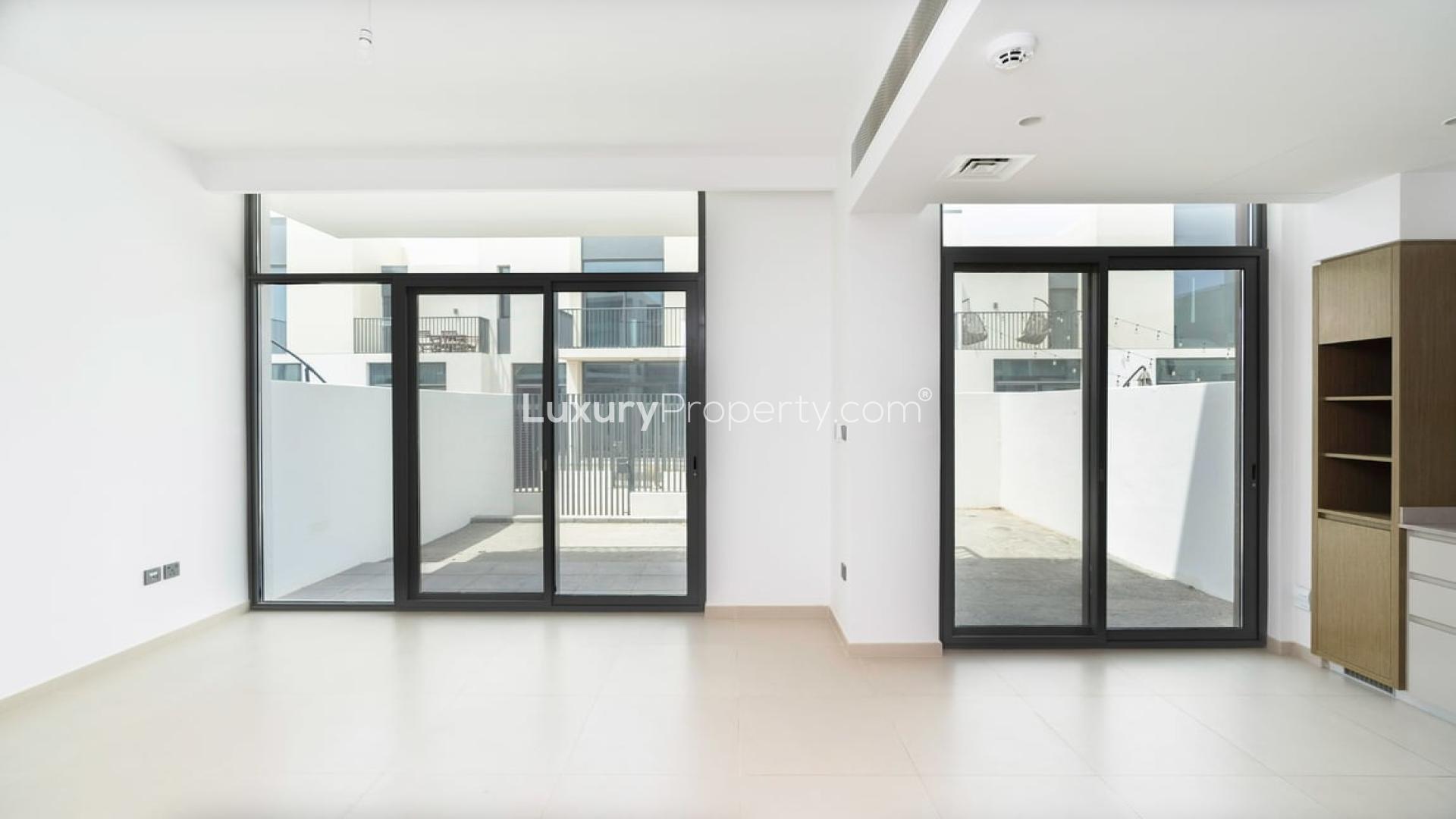 Exterior view of modern townhouse in Joy, Arabian Ranches 3, with gated courtyard