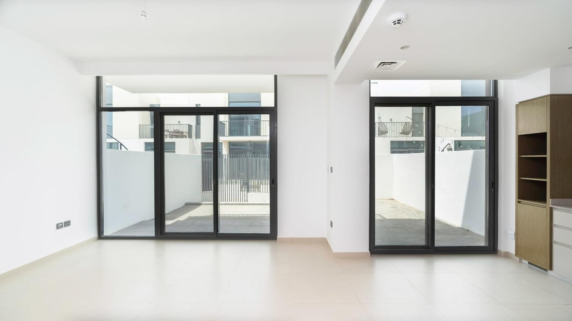 Exterior view of modern townhouse in Joy, Arabian Ranches 3, with gated courtyard