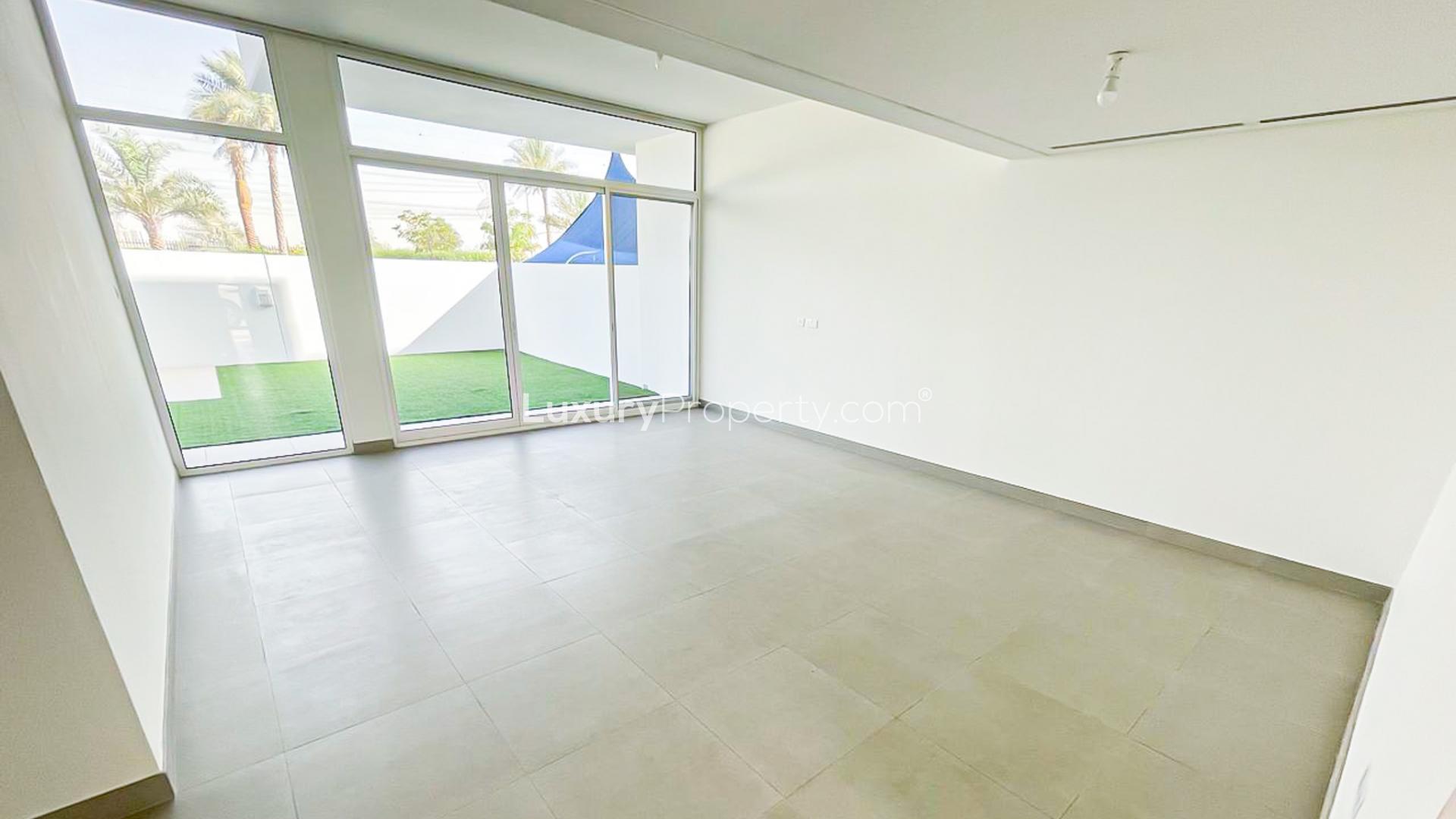 Charming 3-bed townhouse exterior with carport in Arabella Townhouses, Mudon for rent