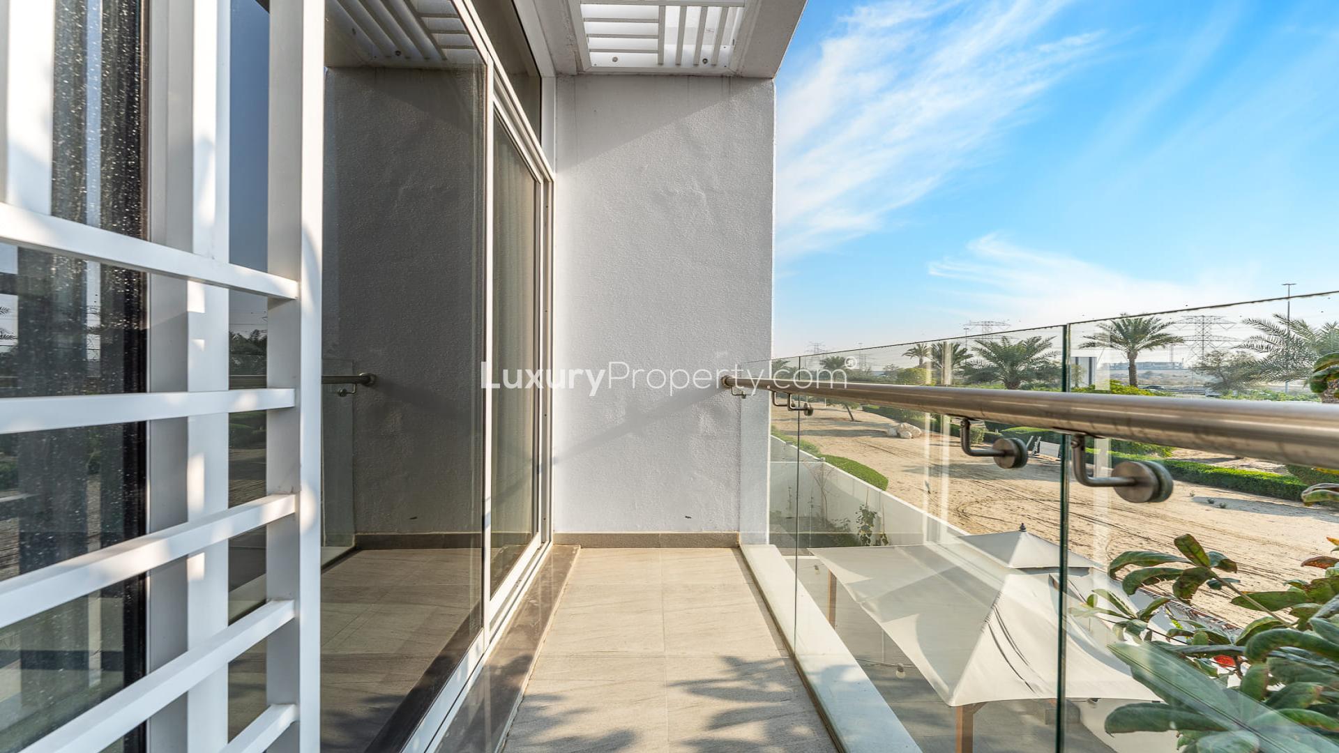 Bright living room in Mudon Arabella townhouse with garden view through large windows