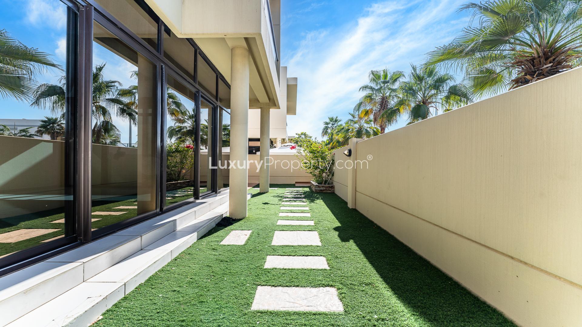 Private garden with lush greenery in spacious Damac Hills townhouse, Richmond community