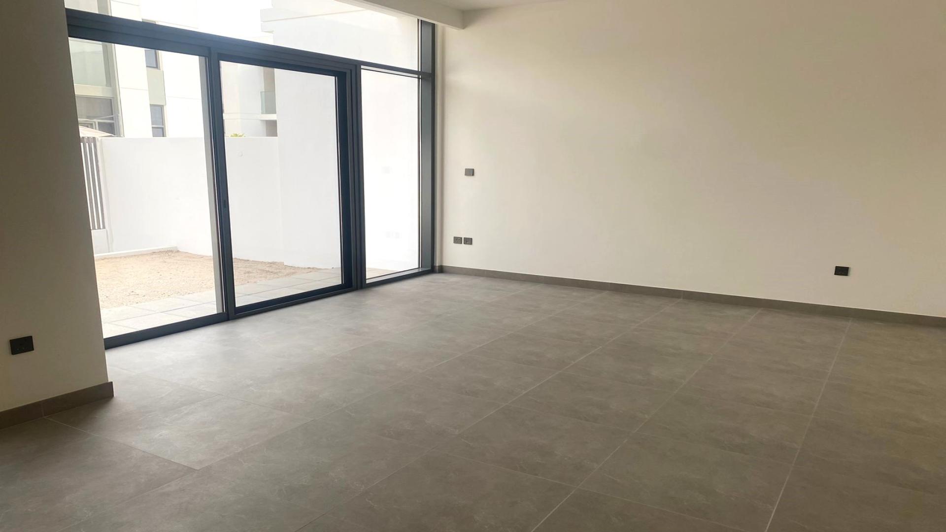 Modern kitchen and living area in Ruba townhouse, Arabian Ranches 3, for rent