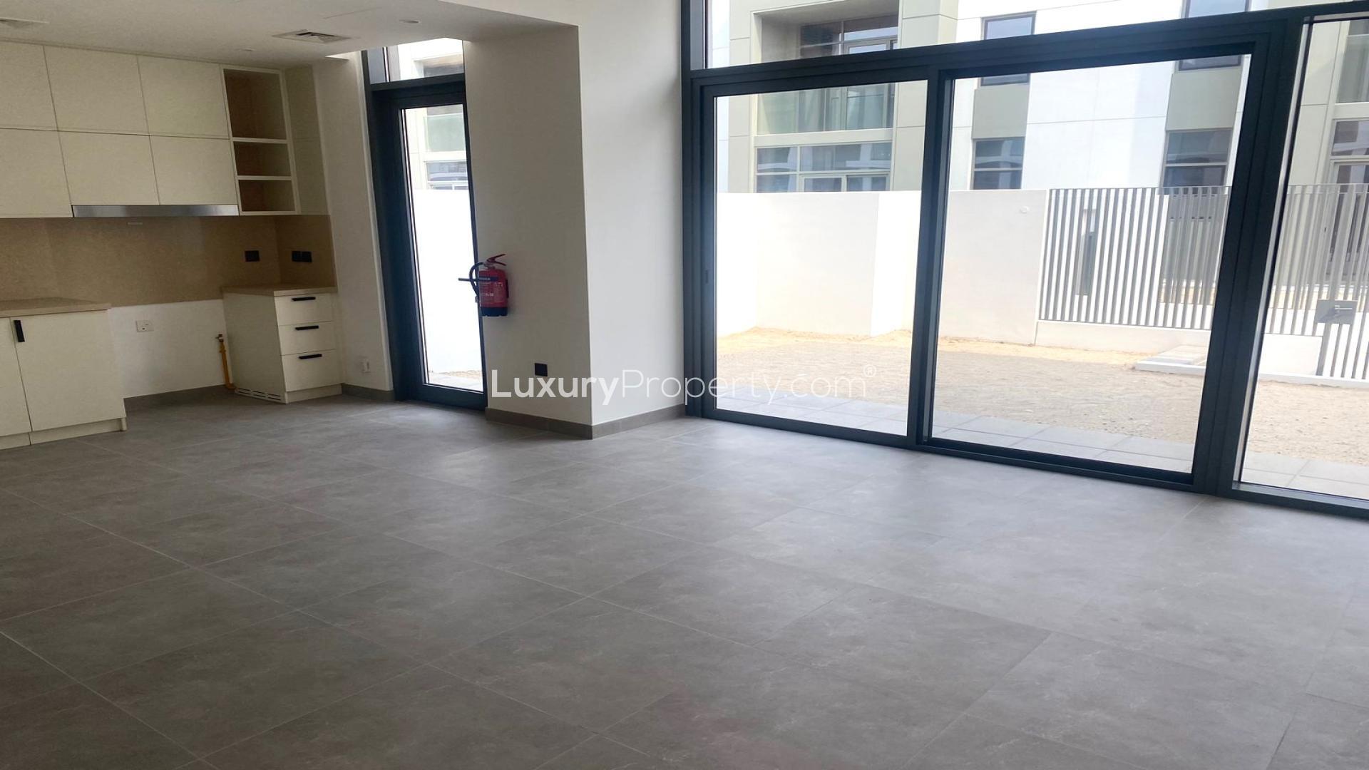 Modern living room with large windows in Ruba townhouse, Arabian Ranches 3