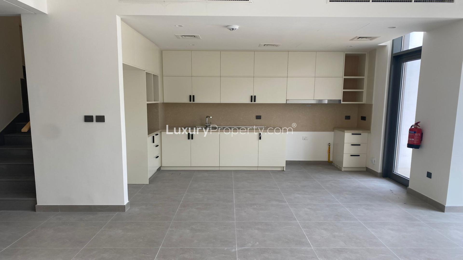 Modern kitchen area in 3-bed villa, Bliss, Arabian Ranches 3, with large windows
