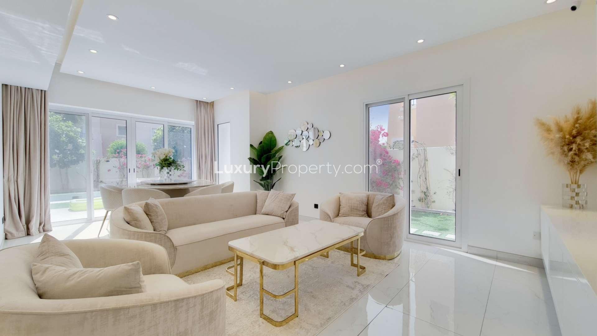 Front view of upgraded villa entrance in Al Reem, Arabian Ranches, with outdoor seating