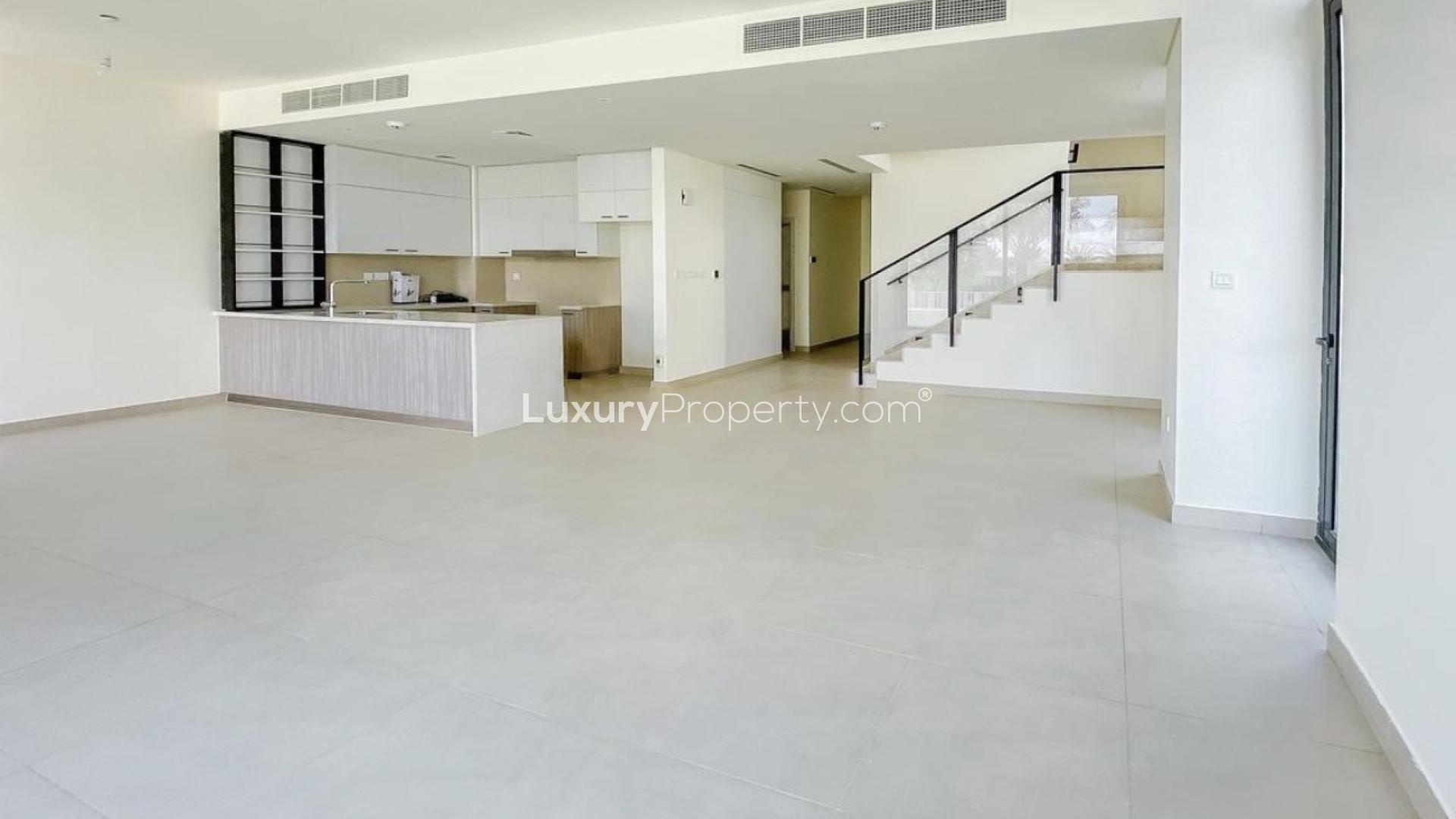 Modern townhouse exterior with patio in Club Villas, Dubai Hills Estate, available for rent