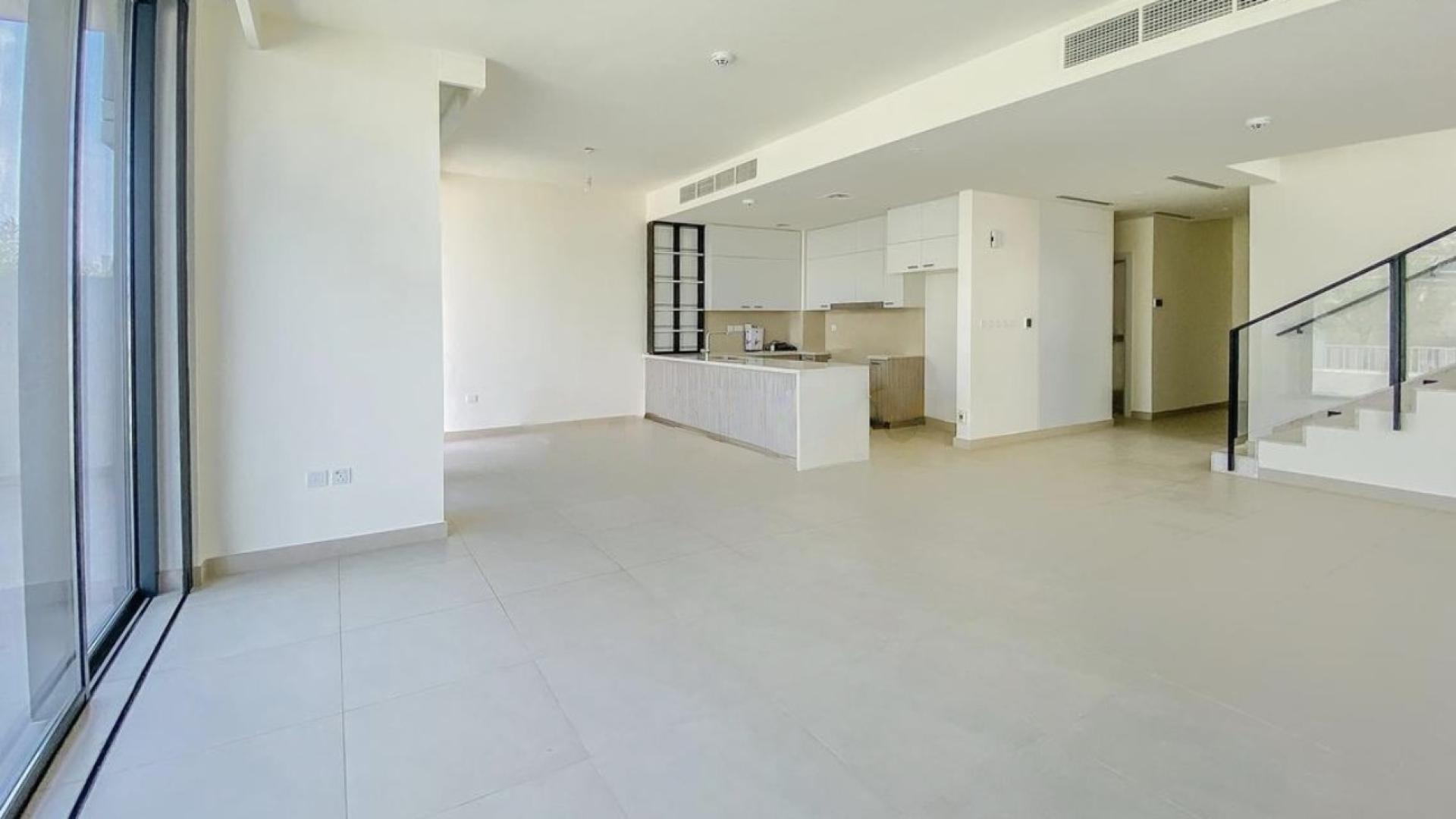 Modern open-plan kitchen and living area in Dubai Hills Estate townhouse for rent