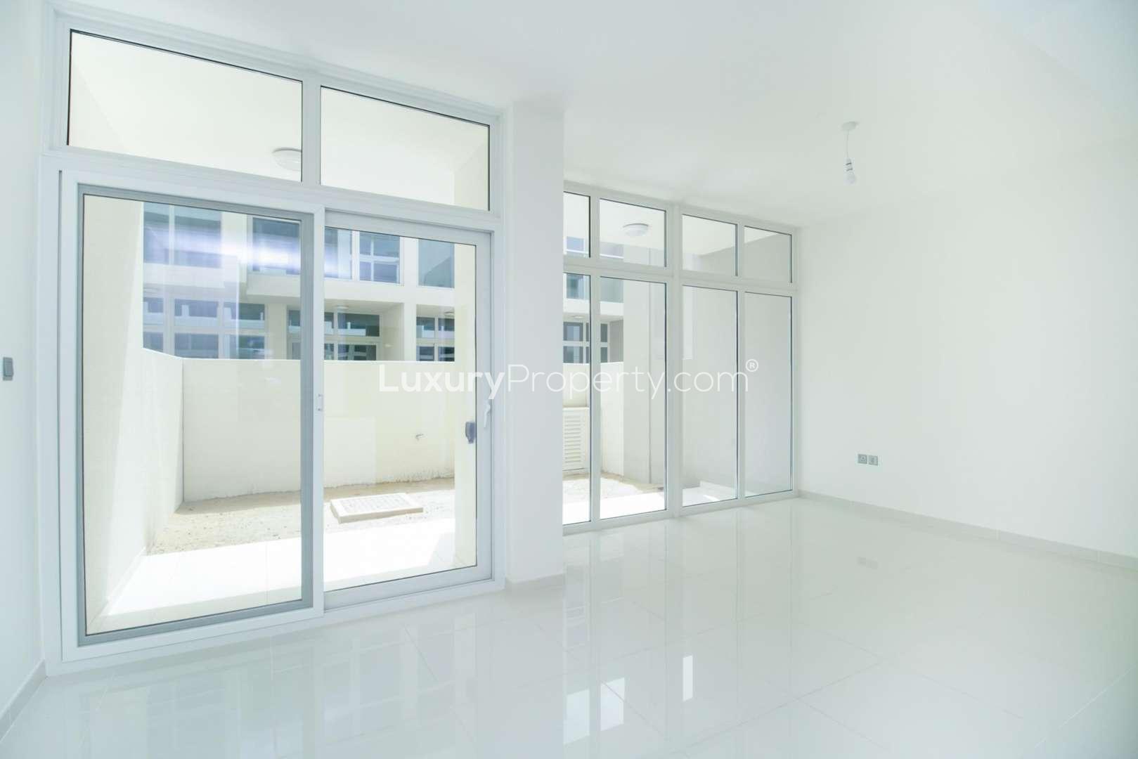 Modern kitchen in Akoya Oxygen townhouse for rent, featuring sleek countertops and cabinetry