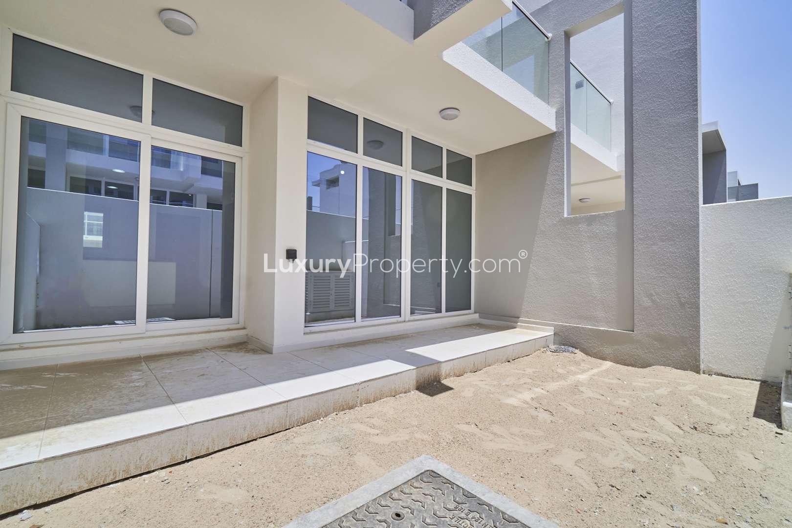 Spacious living area with large windows in Albizia townhouse, Damac Hills 2 for rent