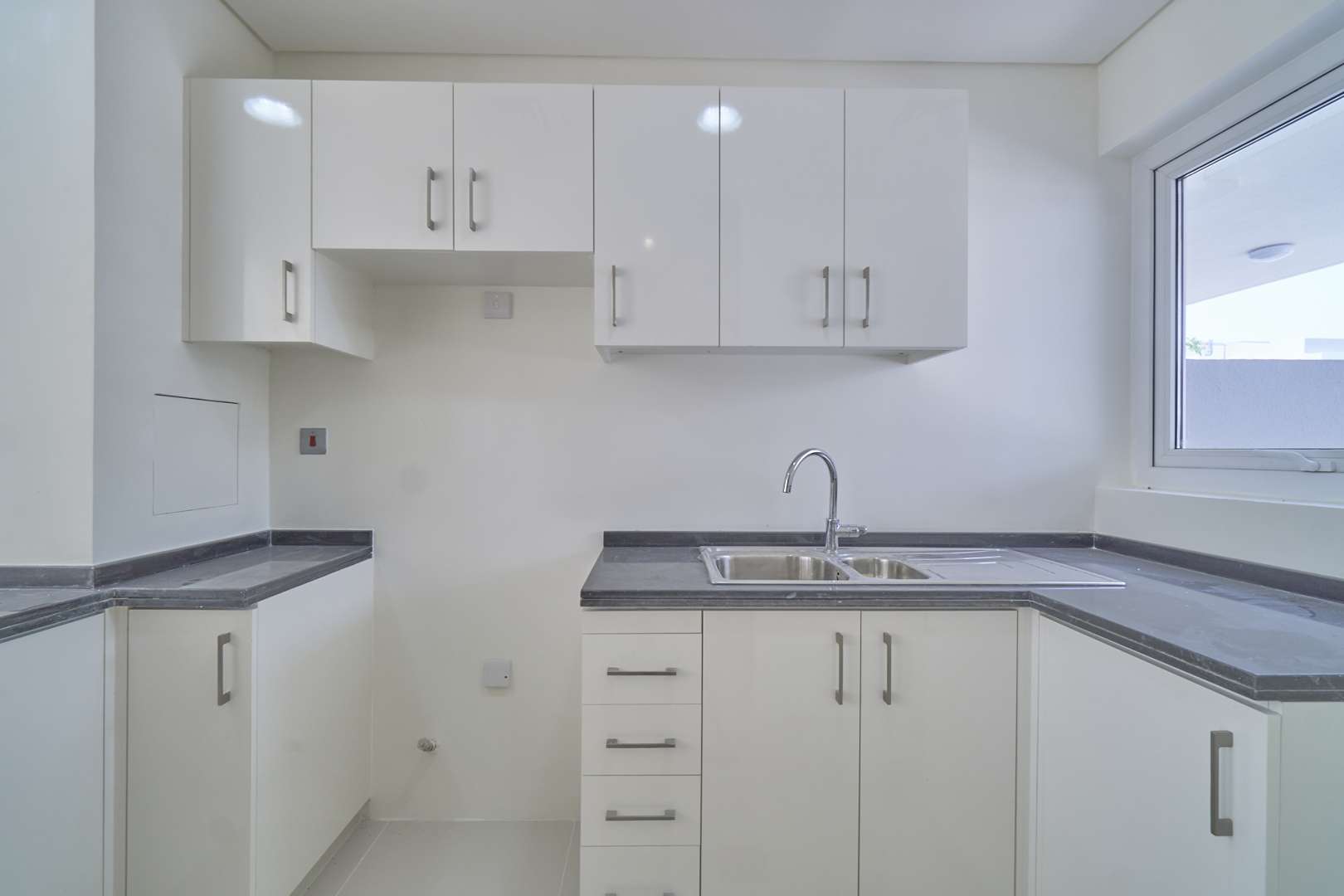 Modern kitchen and entryway in 3-bedroom townhouse, Albizia, Damac Hills 2, for rent