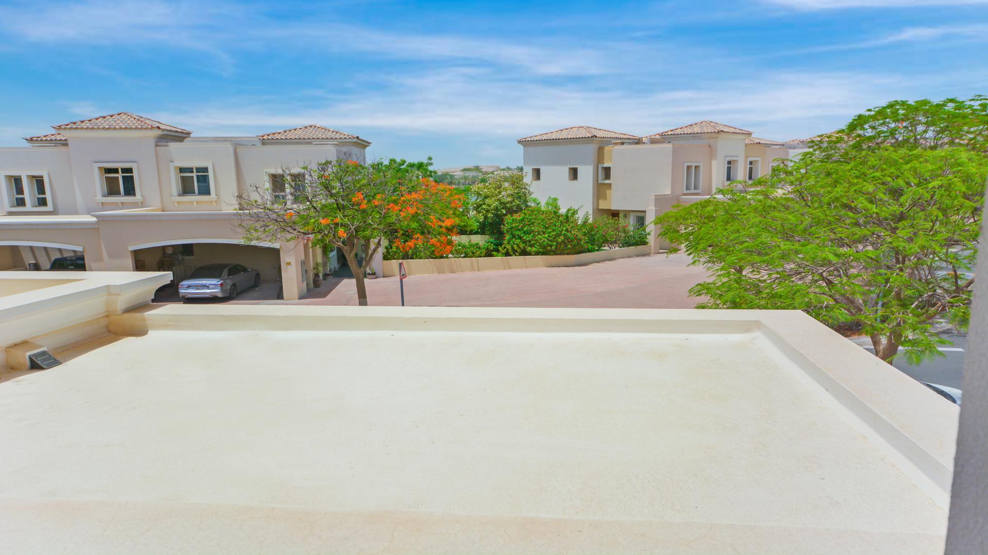 "Spacious living area in Alma townhouse, Arabian Ranches, with garden view and modern decor.","Charming townhouse in Arabian Ranches' Alma community with lush greenery and serene surroundings.",Bright living area in Arabian Ranches townhouse for rent, featuring large windows and tile flooring