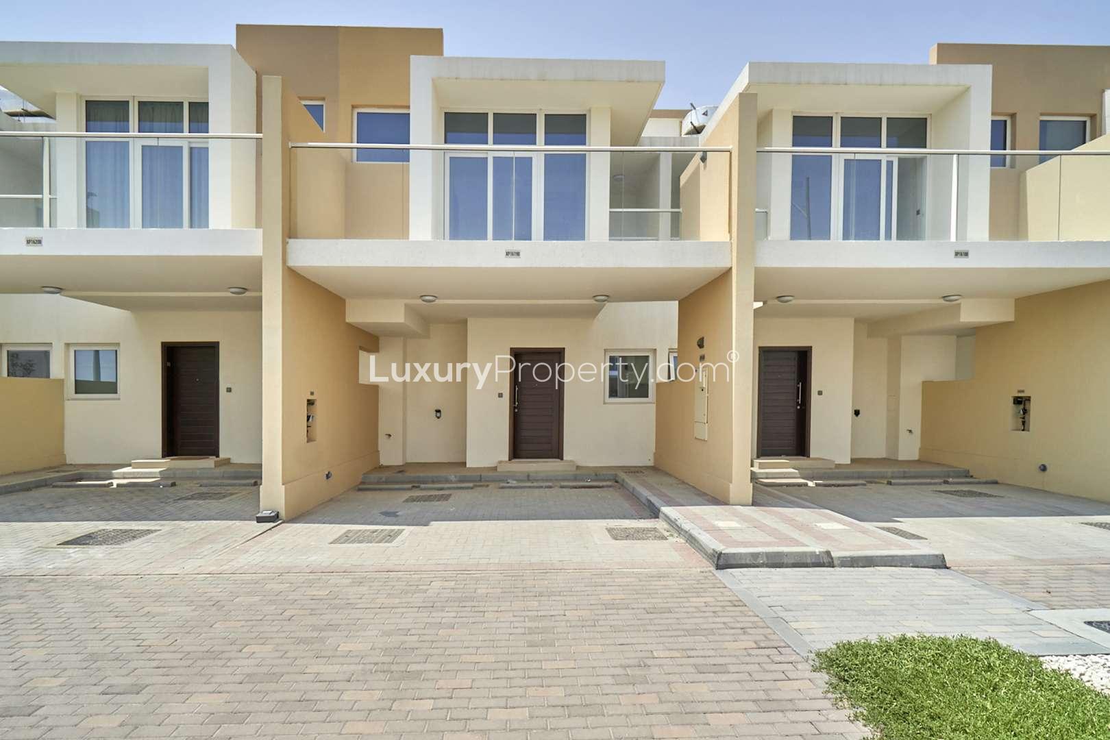 Bright living room with large windows in 3-bedroom townhouse, Damac Hills 2, Avencia