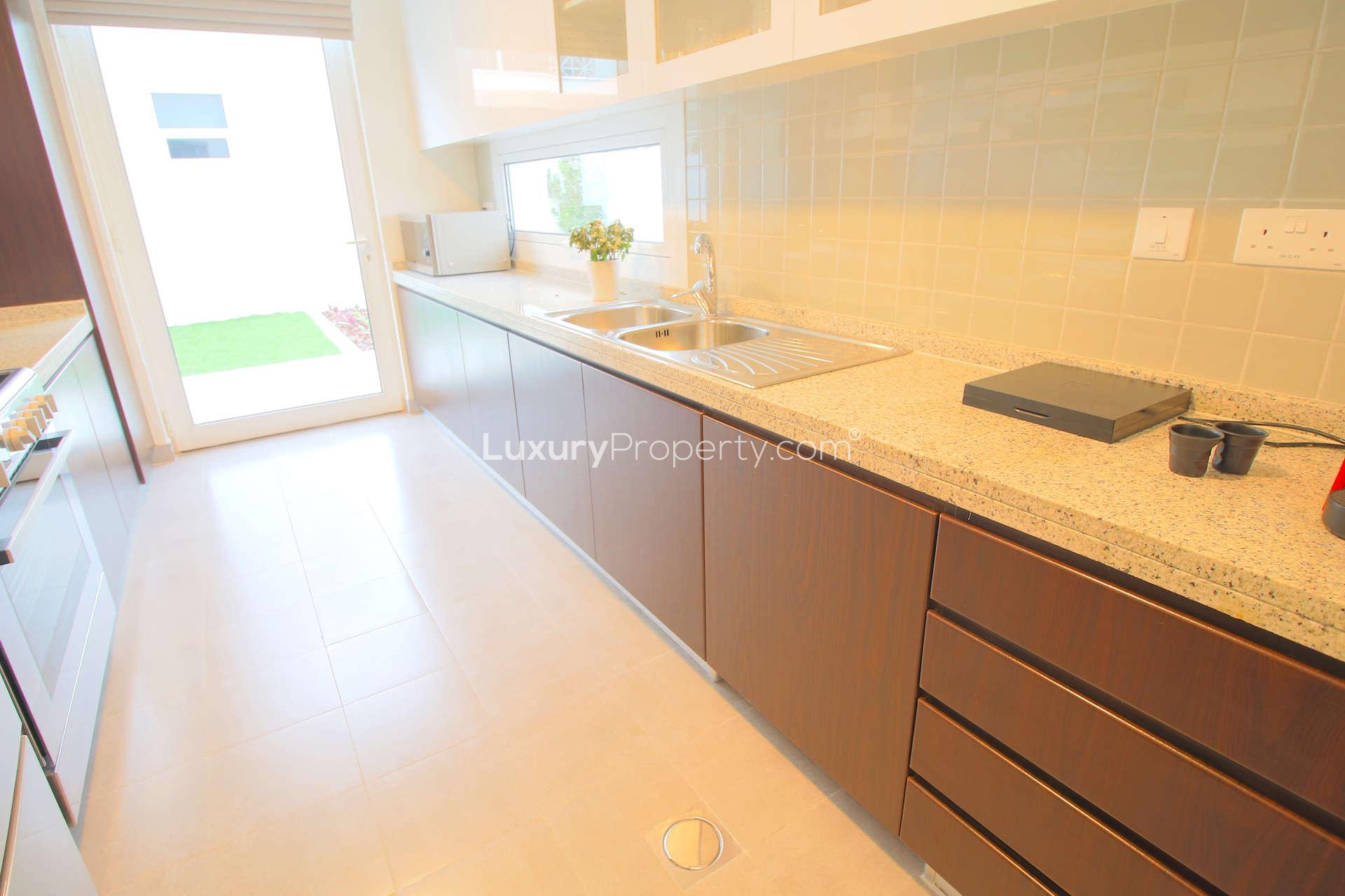 Modern kitchen in 3-bedroom townhouse for sale, Arabella 2 Mudon, with garden view