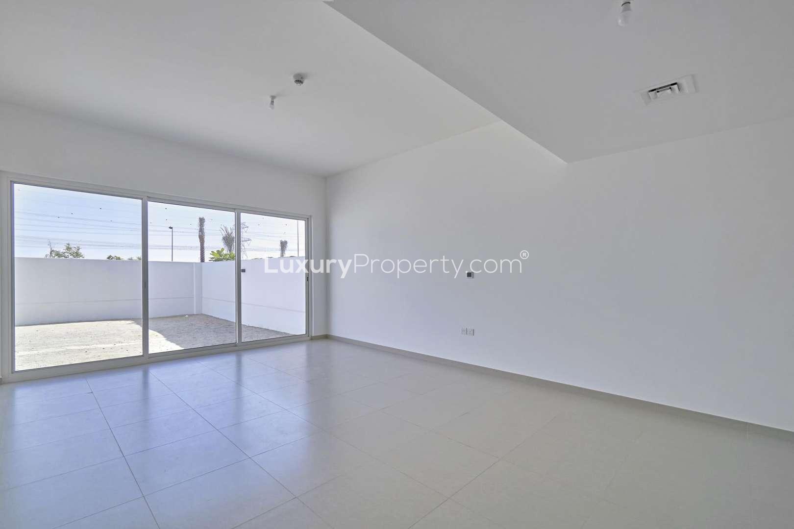 Spacious living area in 3-bed Arabella townhouse, Mudon, featuring modern design and ample light