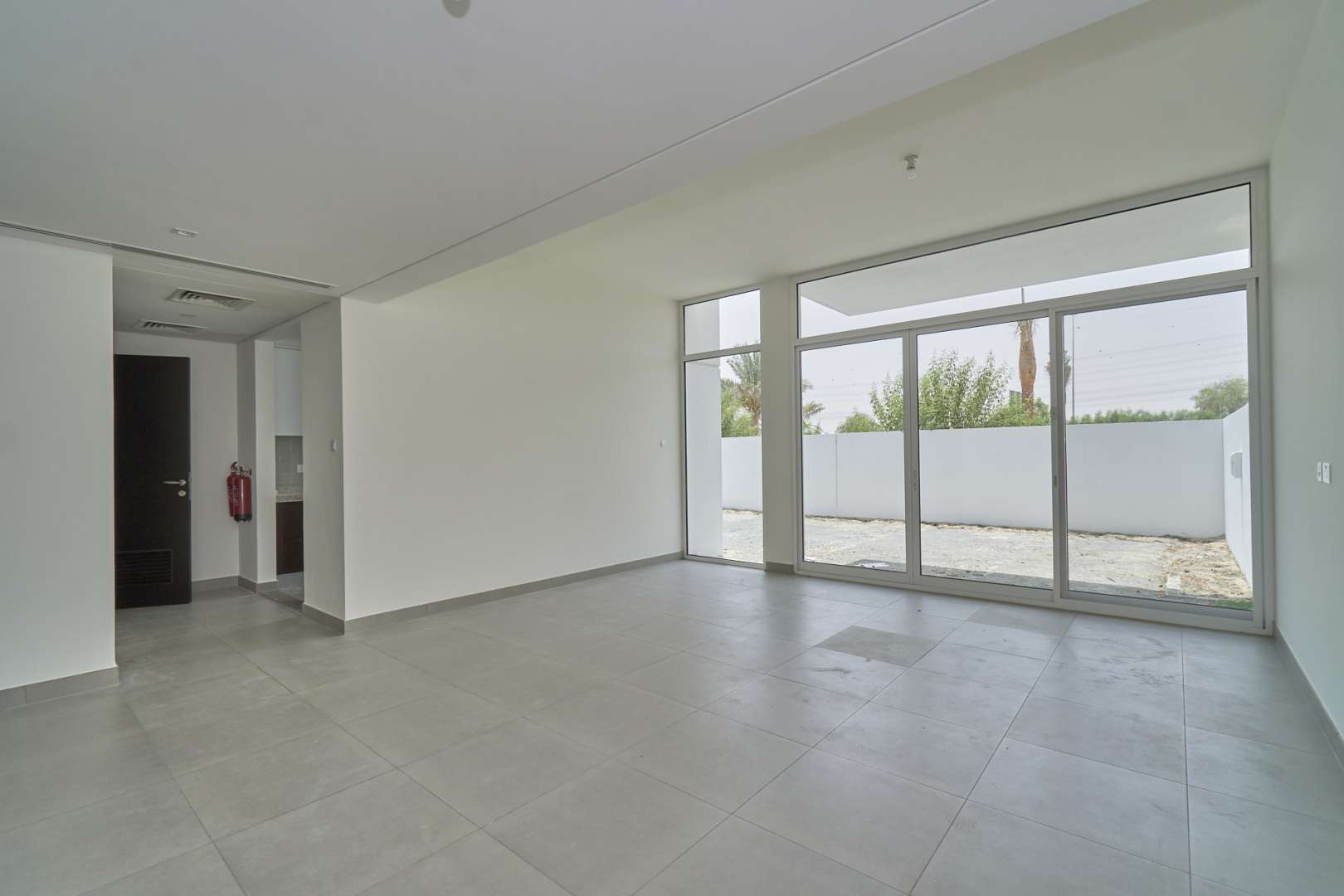 Spacious living room with large windows in Mudon Arabella 3 townhouse for rent