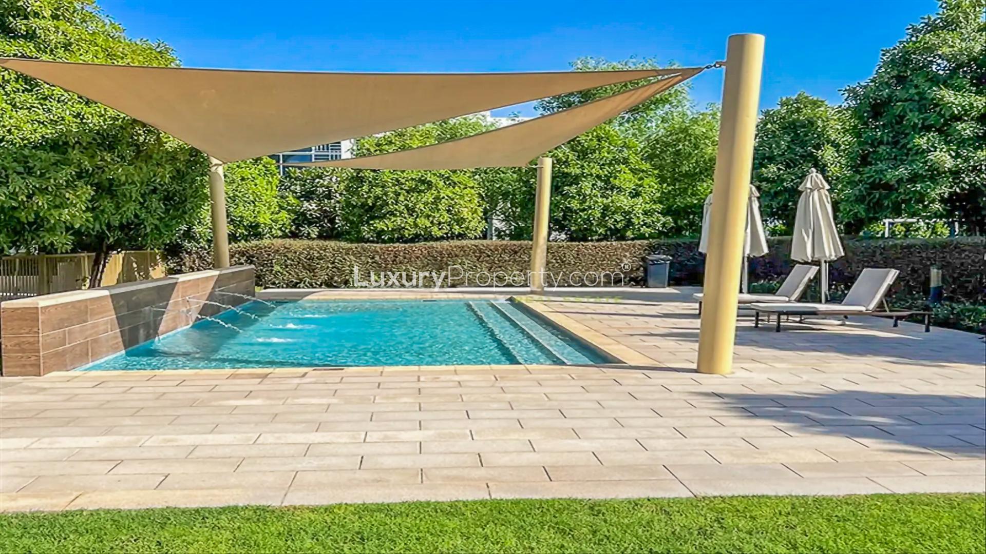 Bright living area in Arabella 2 townhouse, Mudon, with large windows and garden view