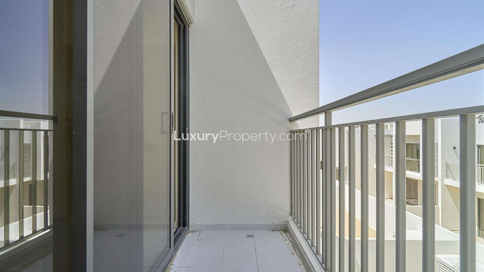 Bright bedroom with large windows in Aster townhouse, Damac Hills 2, available for rent