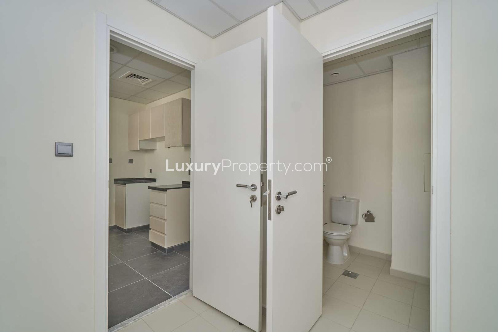 Modern kitchen and bathroom in Aster townhouse, Damac Hills 2, available for rent