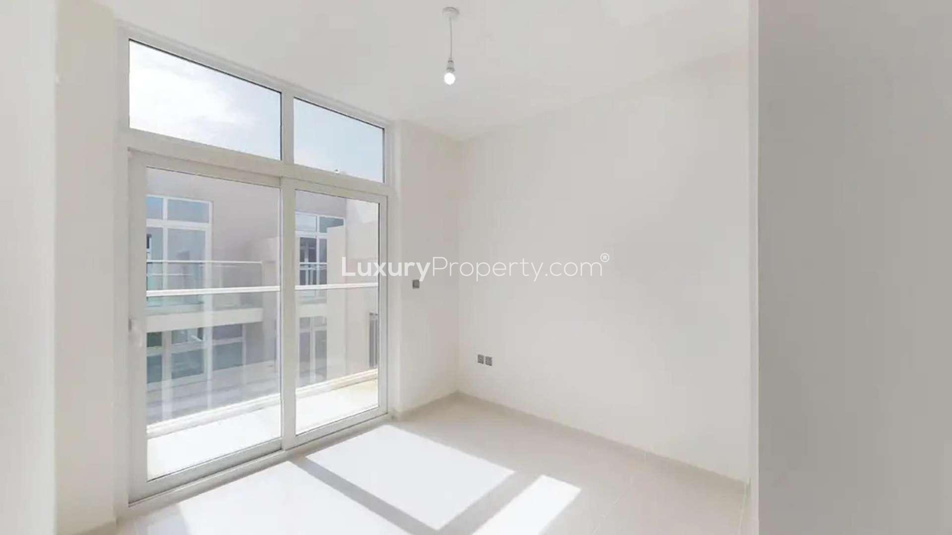 Modern 3-bedroom townhouse exterior in Basswood, Damac Hills 2, available for rent