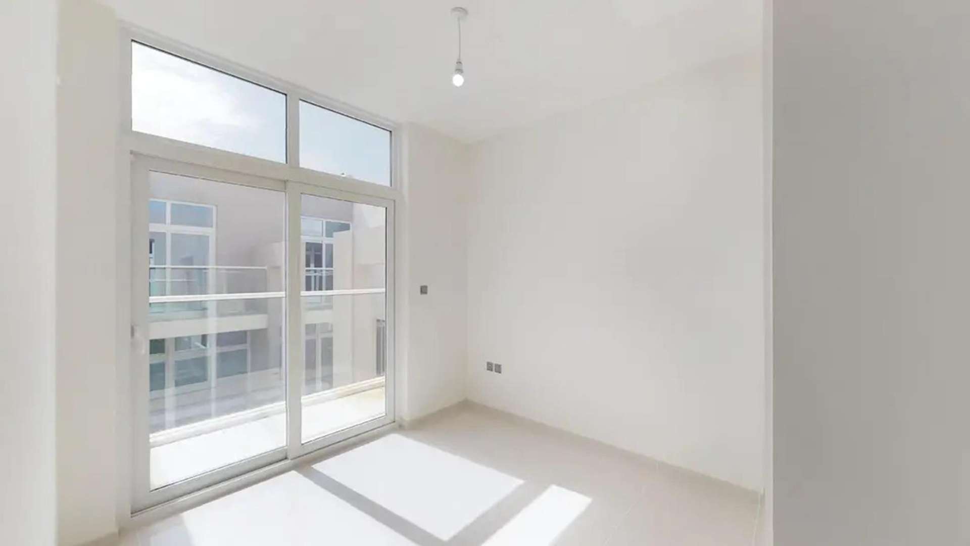 Modern 3-bedroom townhouse exterior in Basswood, Damac Hills 2, available for rent