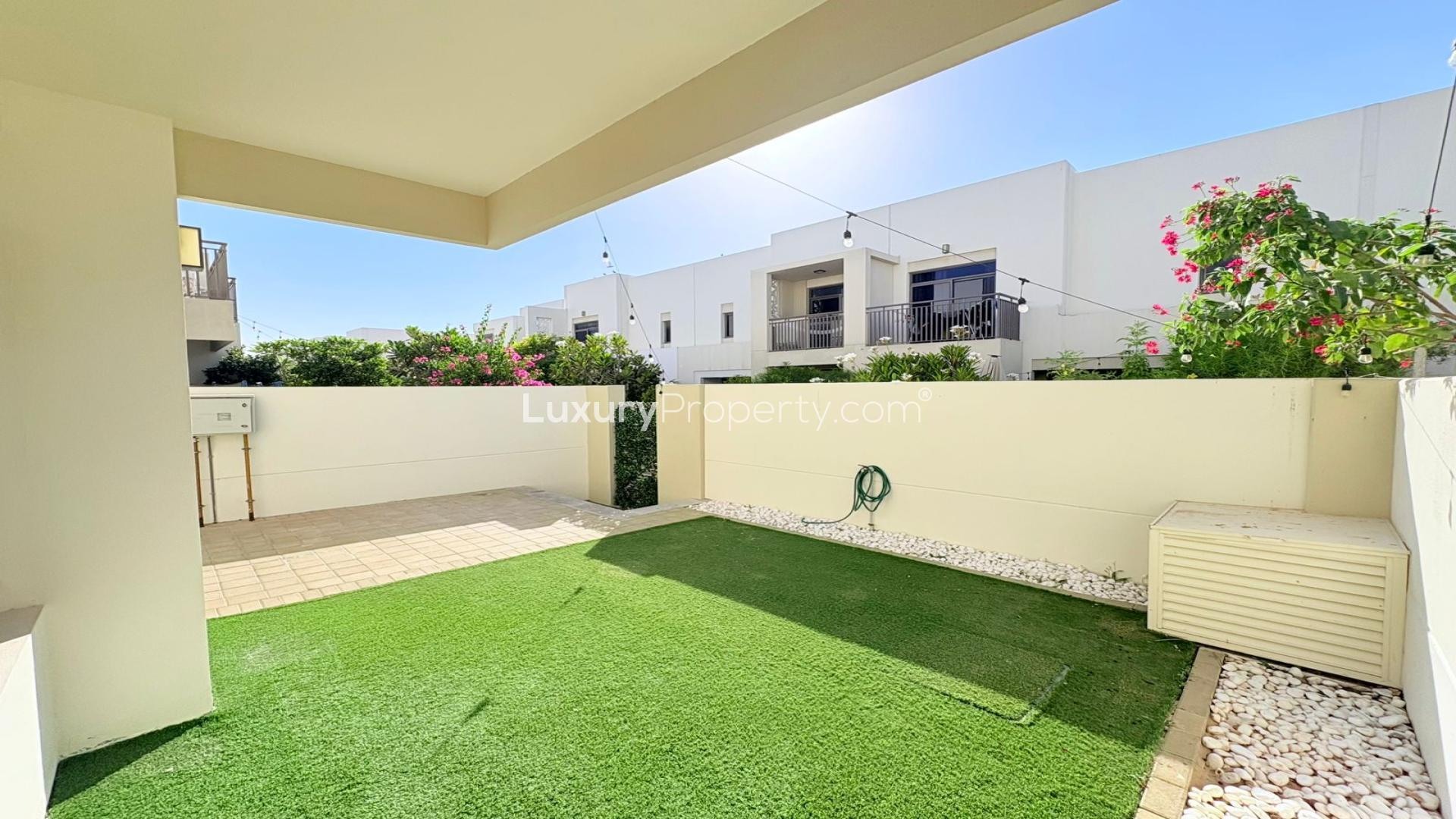 Bright open-plan kitchen and living area in Town Square Noor Townhouses for rent