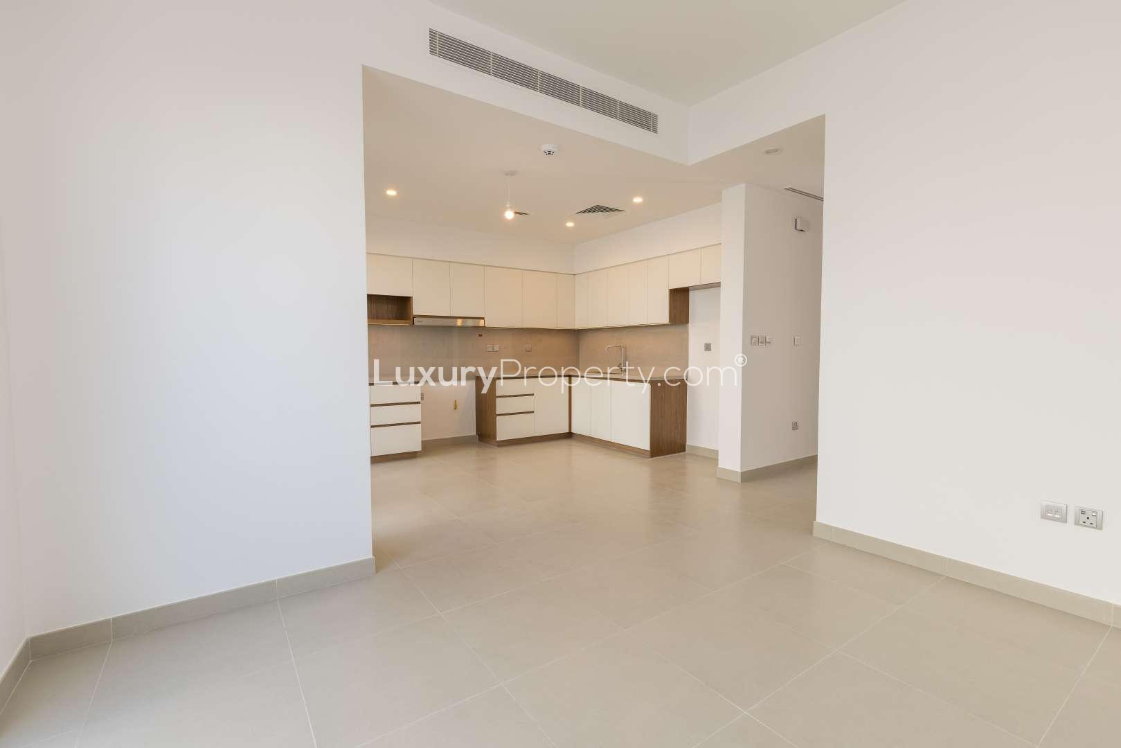 Bright living area with sliding glass doors in Camelia townhouse, Arabian Ranches 2