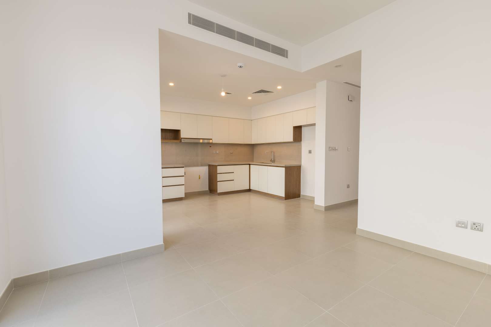 Bright living area with sliding glass doors in Camelia townhouse, Arabian Ranches 2