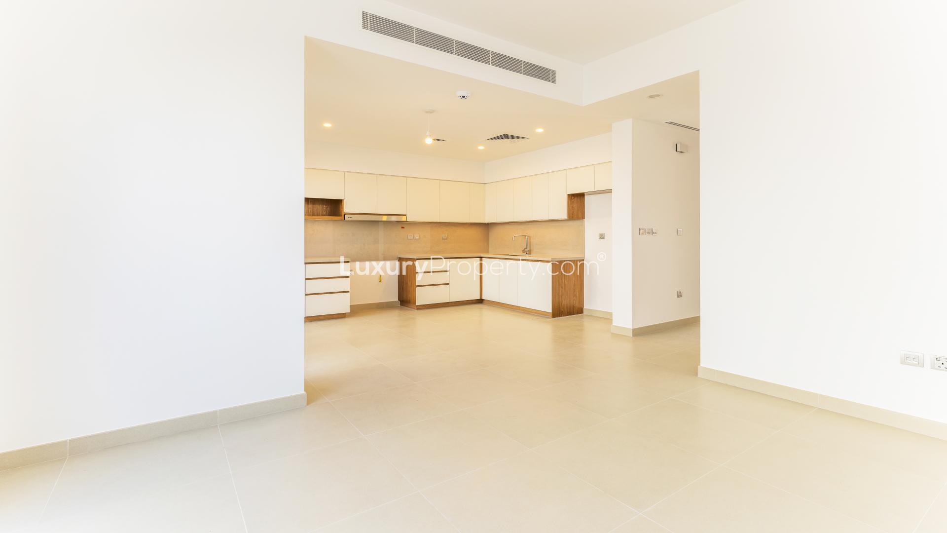 Bright living area with large windows in Arabian Ranches 2 townhouse for rent