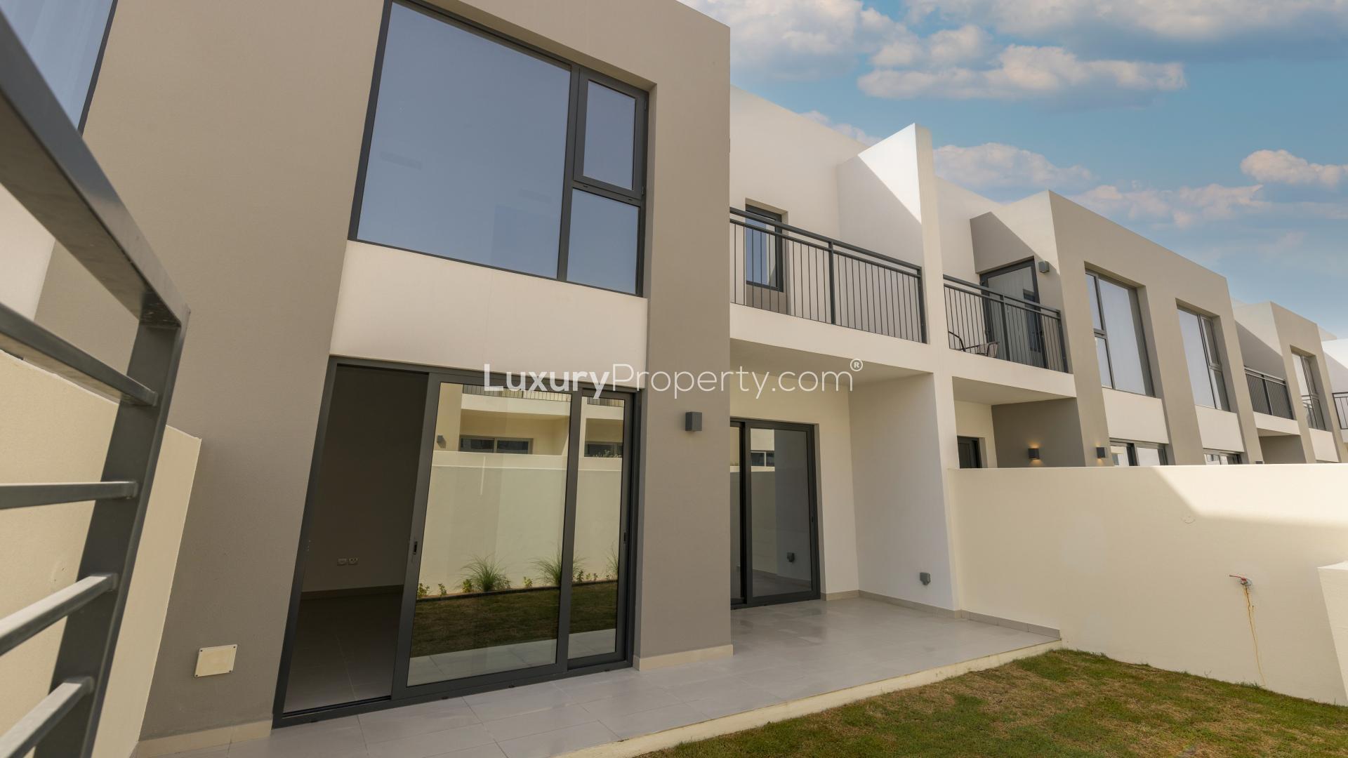 Contemporary living room with large glass doors in Arabian Ranches 2, Camelia townhouse