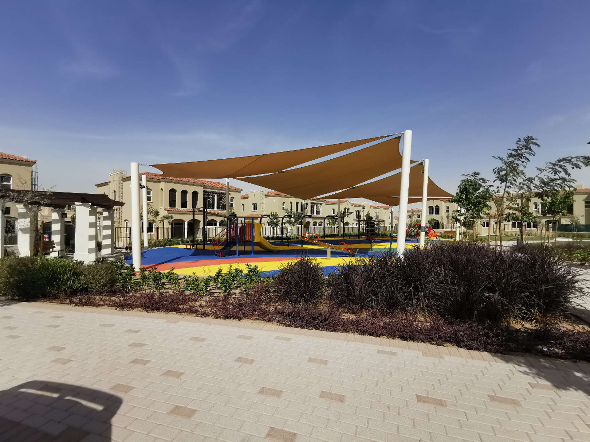 Gated townhouse backyard in Casa Dora, Serena, Dubailand for rent, featuring privacy walls