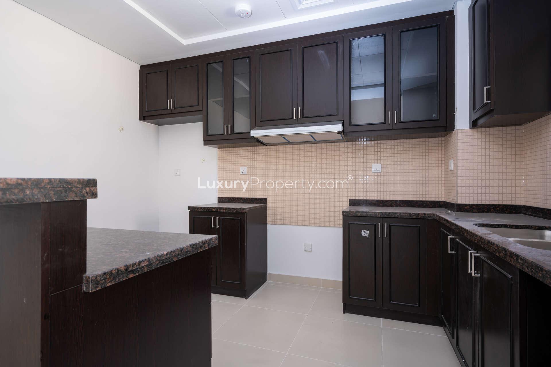 Exterior view of Casa Dora townhouse with carport in Serena community