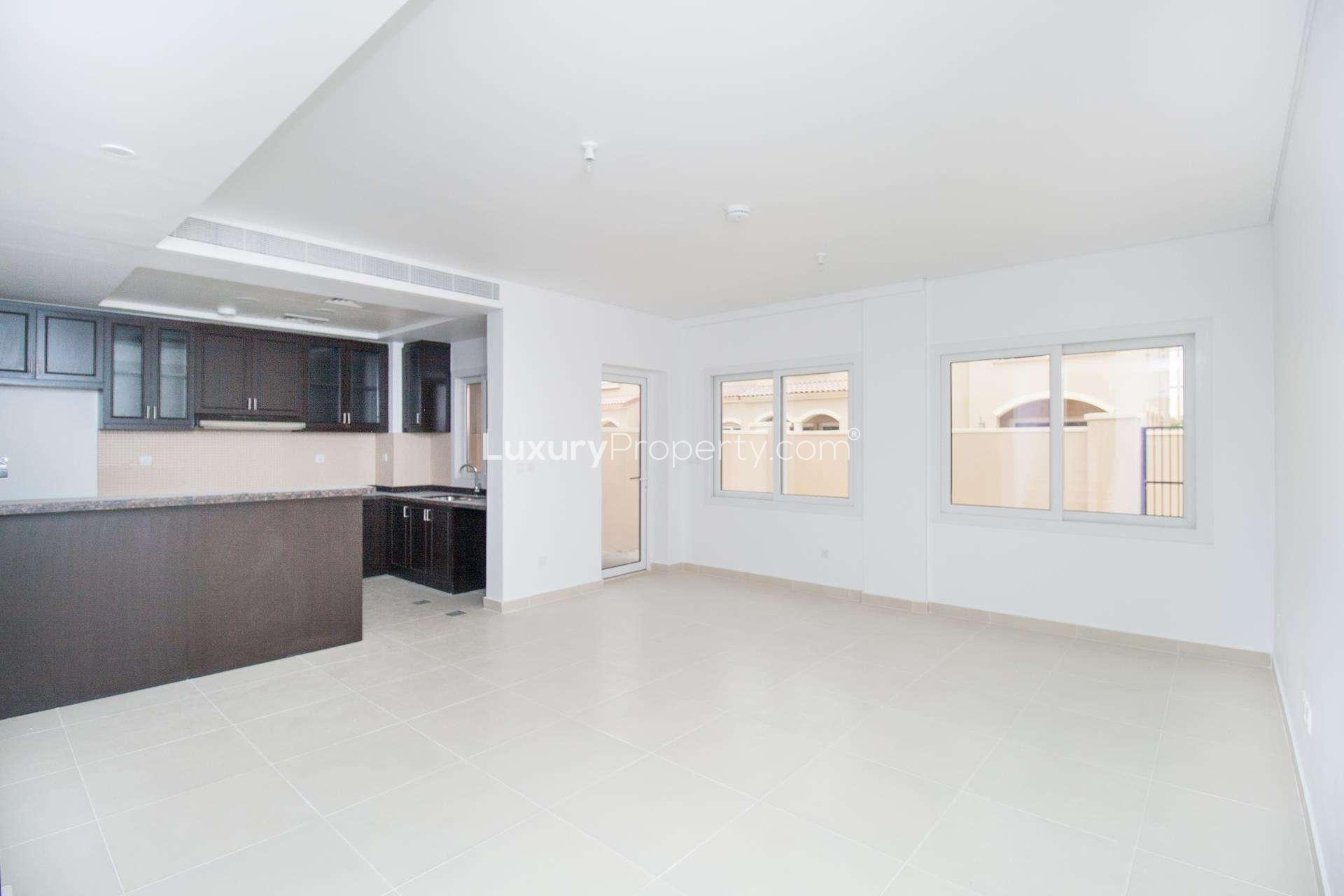 "Serena Casa Dora townhouse for sale, 3 bedrooms, 4 bathrooms, single row, residential property.",Spacious open-plan kitchen and living area in Serena Casa Dora townhouse for sale