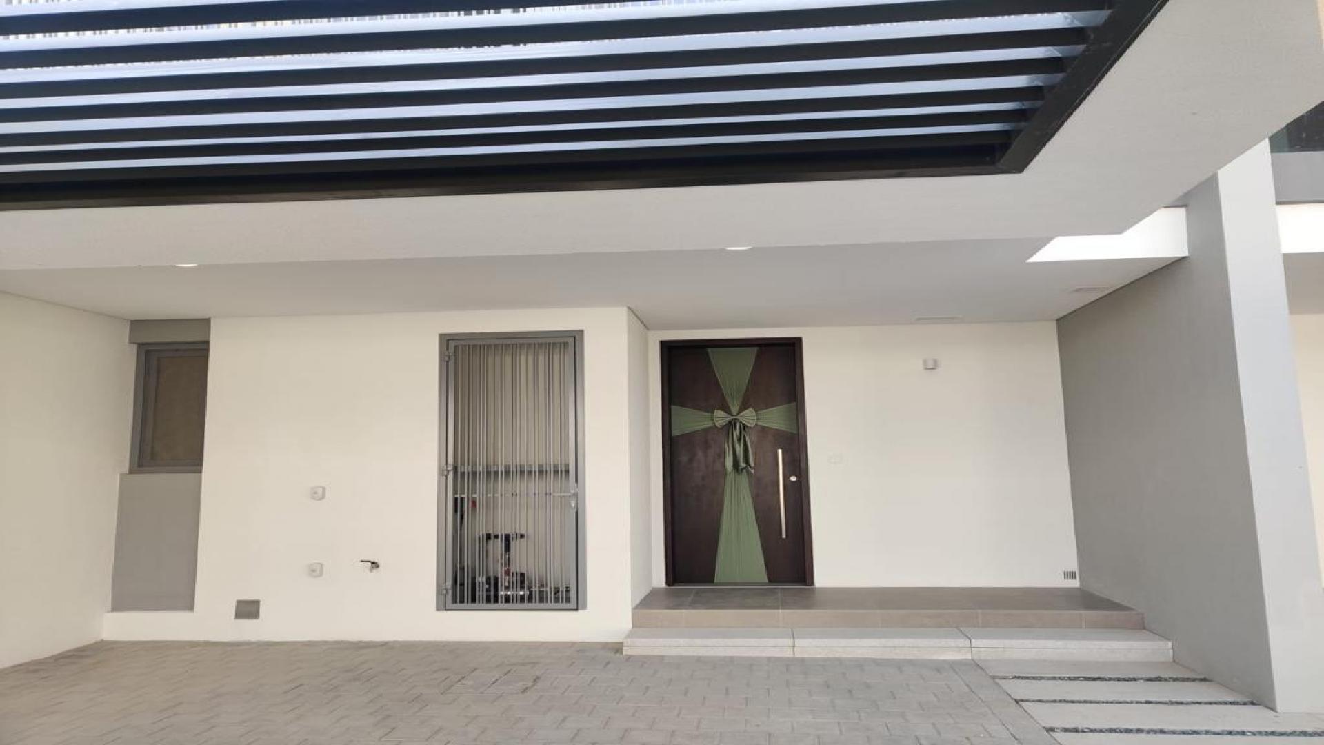 Modern townhouses in Elan, Tilal Al Ghaf, Dubai, showcasing spacious residential architecture