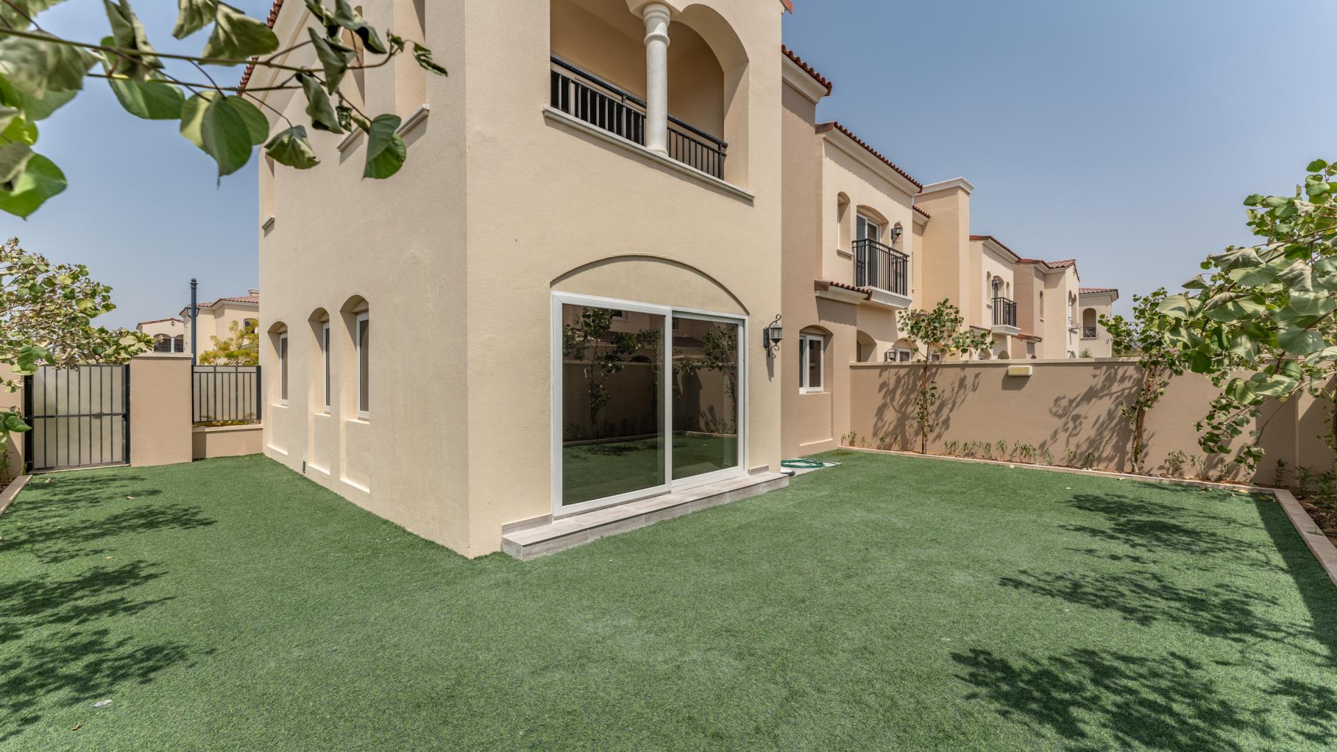 Spacious living area in luxury 3-bedroom villa, Serena Community, Dubai, with garden view