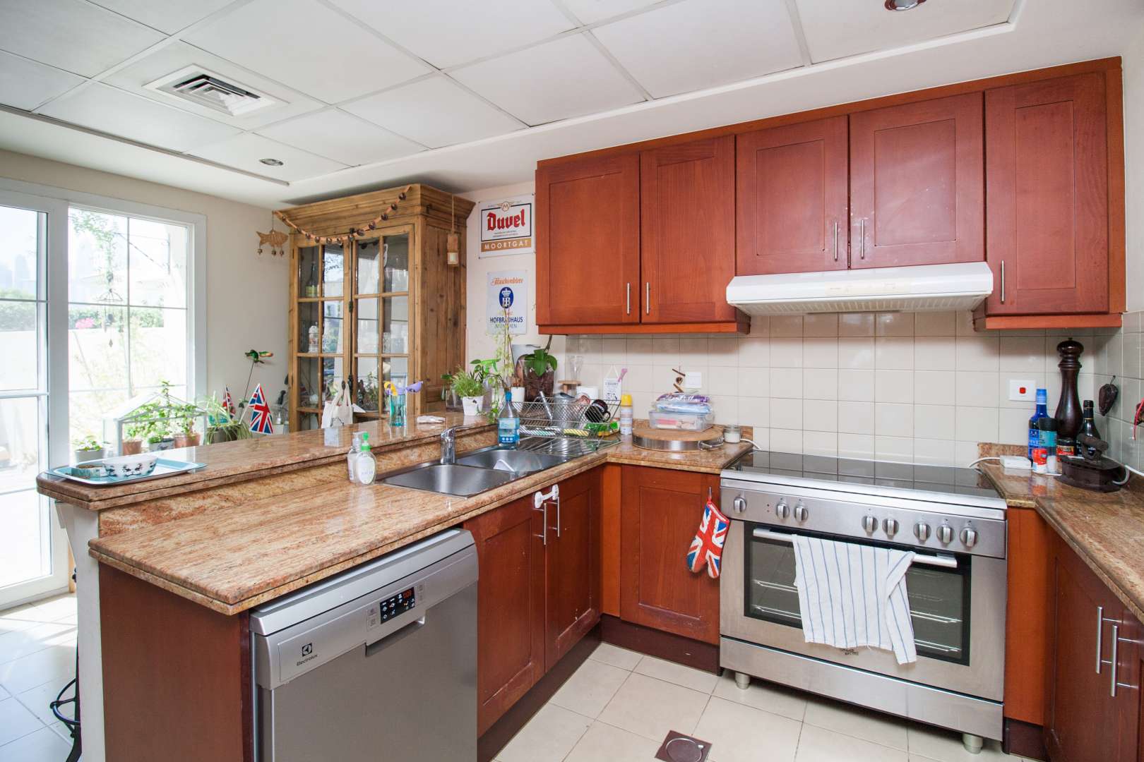 Outdoor communal area with seating and barbecue in Forat, The Lakes townhouse community