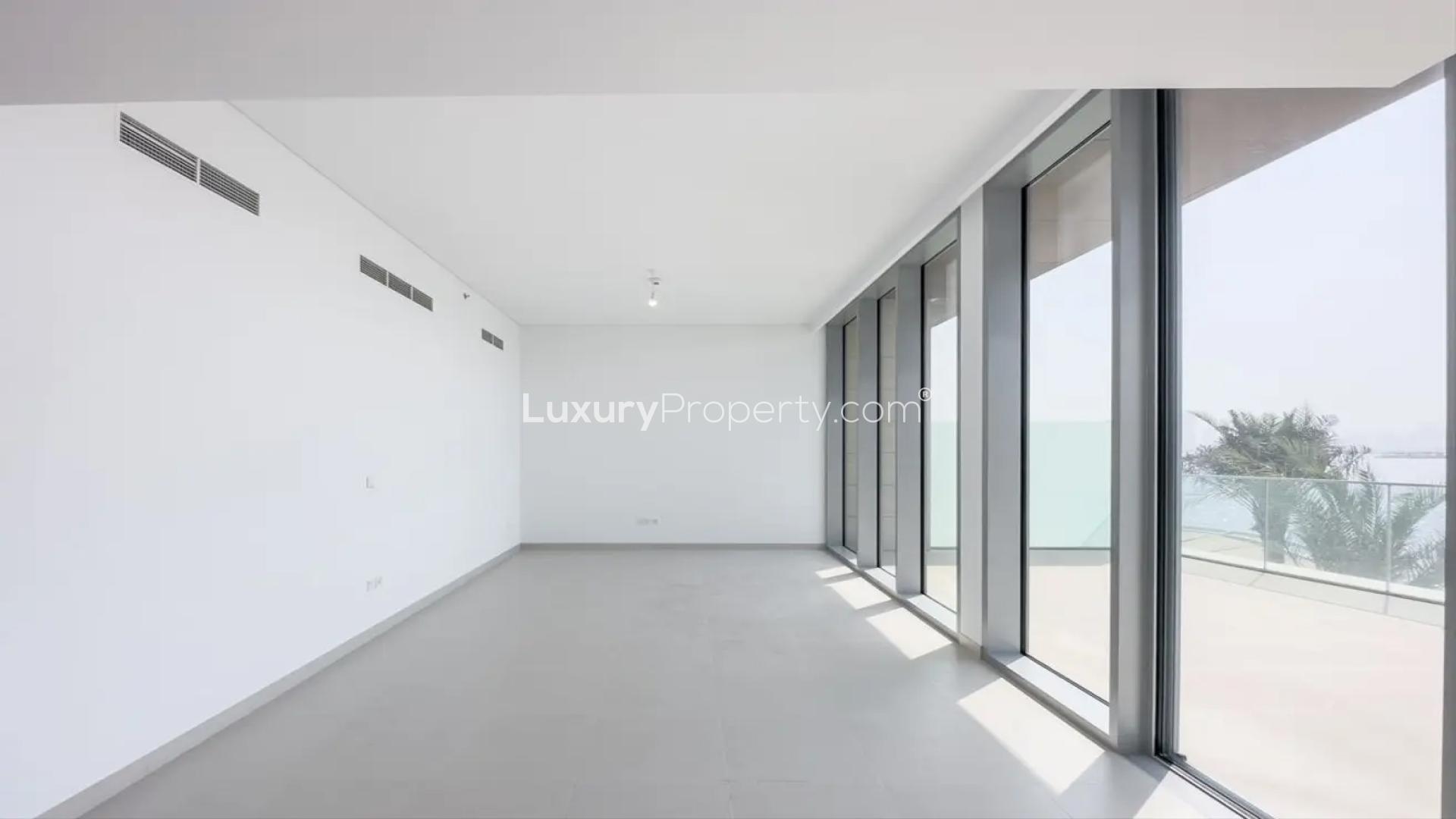 "Dubai Creek Harbour townhouse view overlooking waterfront promenade and skyline at The Grand.","Bright living area in Dubai Creek Harbour townhouse, featuring large windows and balcony view.","Scenic waterfront view from townhouse balcony in The Grand, Dubai Creek Harbour.",Modern kitchen with large windows and waterfront view in Dubai Creek Harbour townhouse