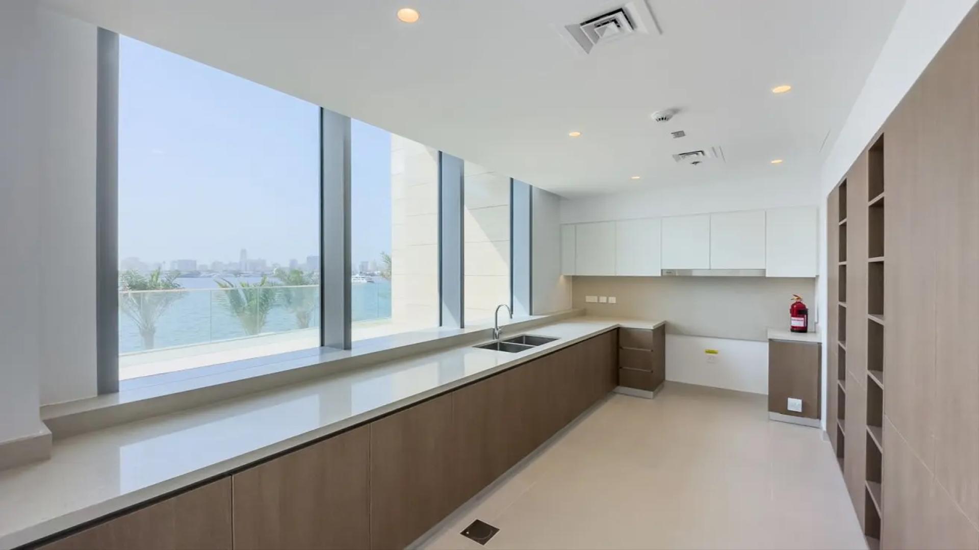 Bright room with large windows and waterfront view in Dubai Creek Harbour townhouse