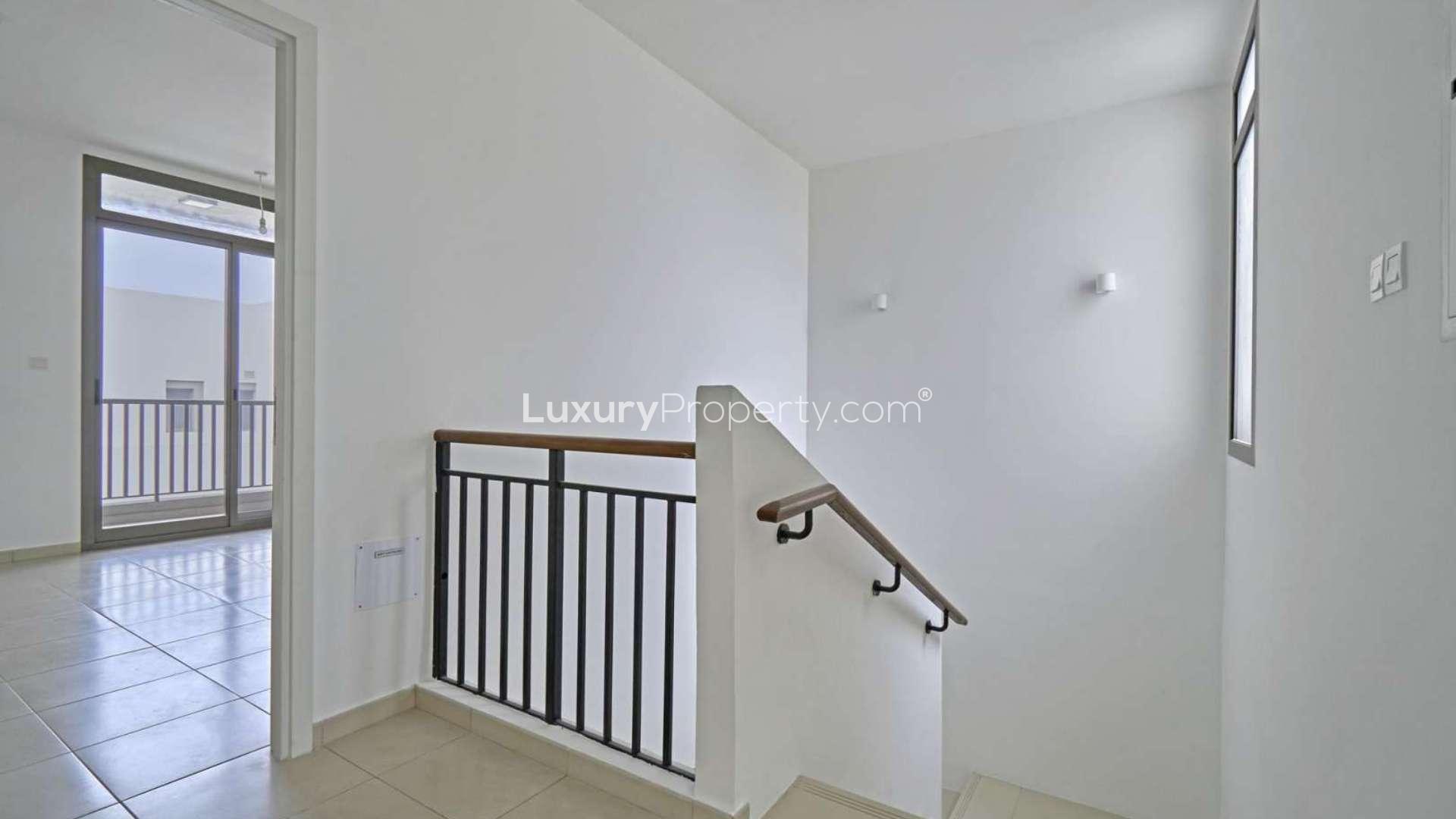 Modern 3-bedroom townhouse exterior with parking in Hayat Townhouses, Town Square, for rent
