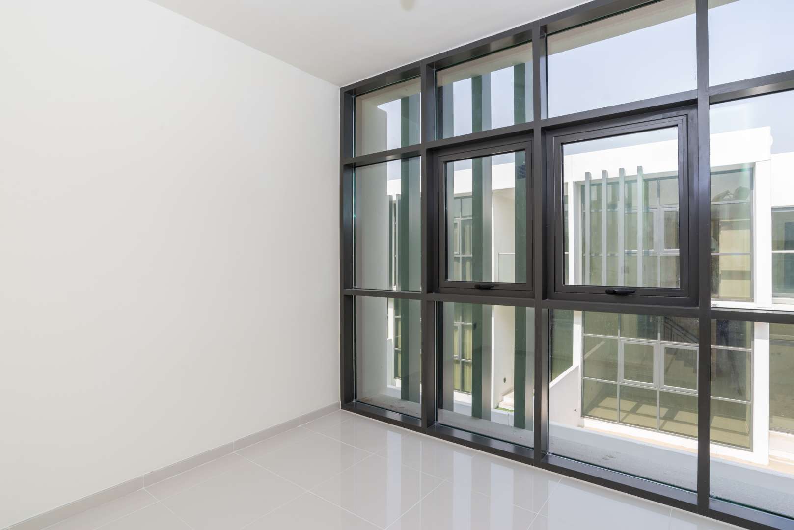 Newly built townhouse window view in Janusia, Damac Hills 2, bright and spacious interior