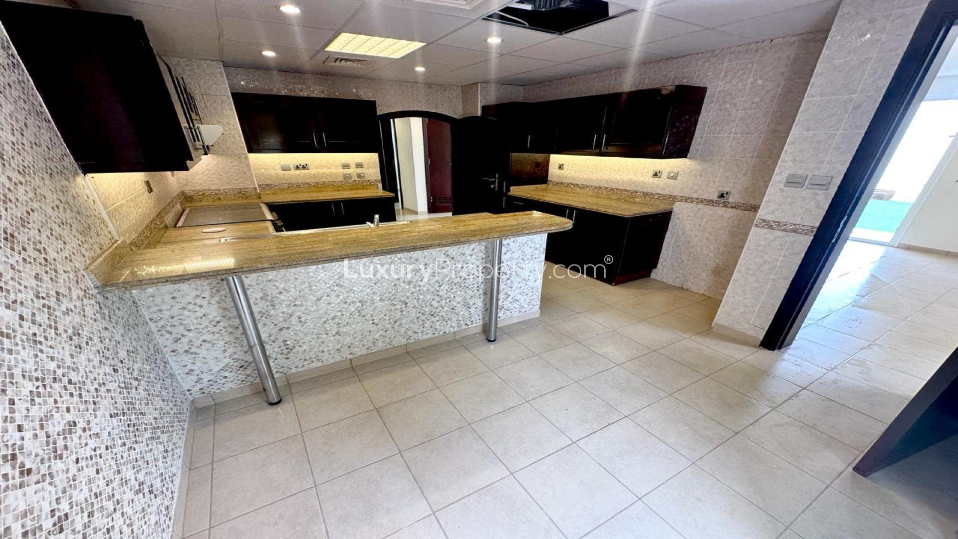 Modern kitchen in 3-bedroom villa for rent, Al Reem, Arabian Ranches, with granite countertops