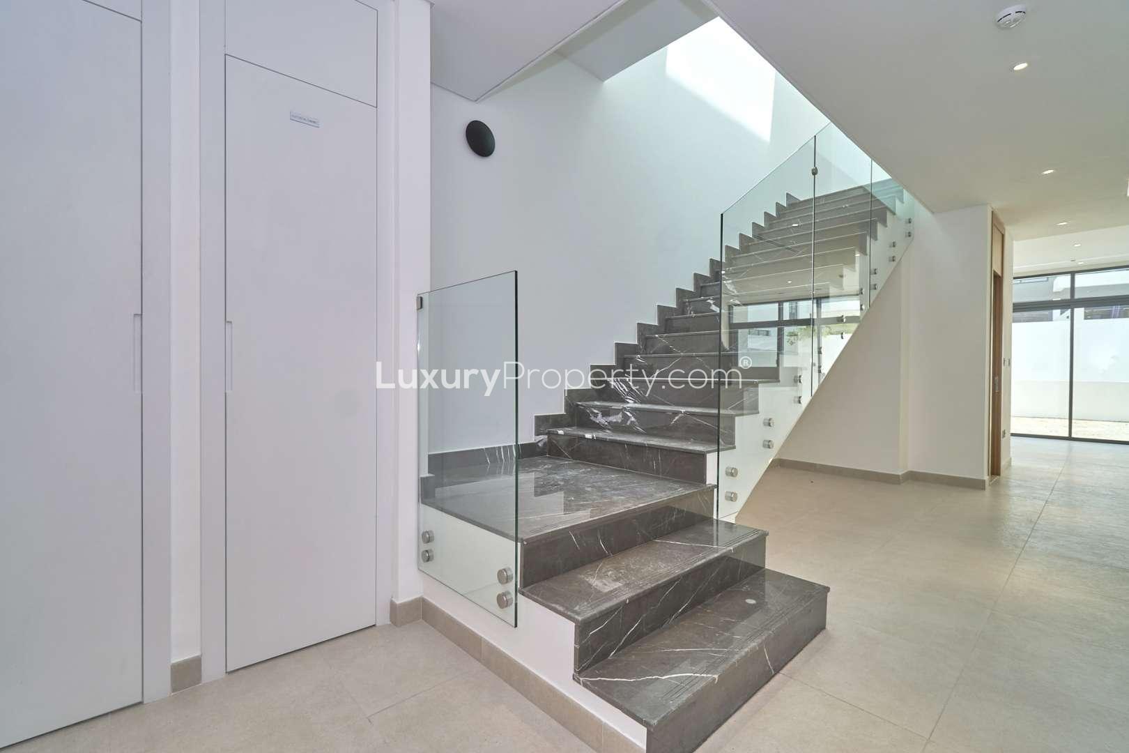 Modern 3-bedroom townhouse exterior in Jumeirah Luxury, Jumeirah Golf Estates, available for rent