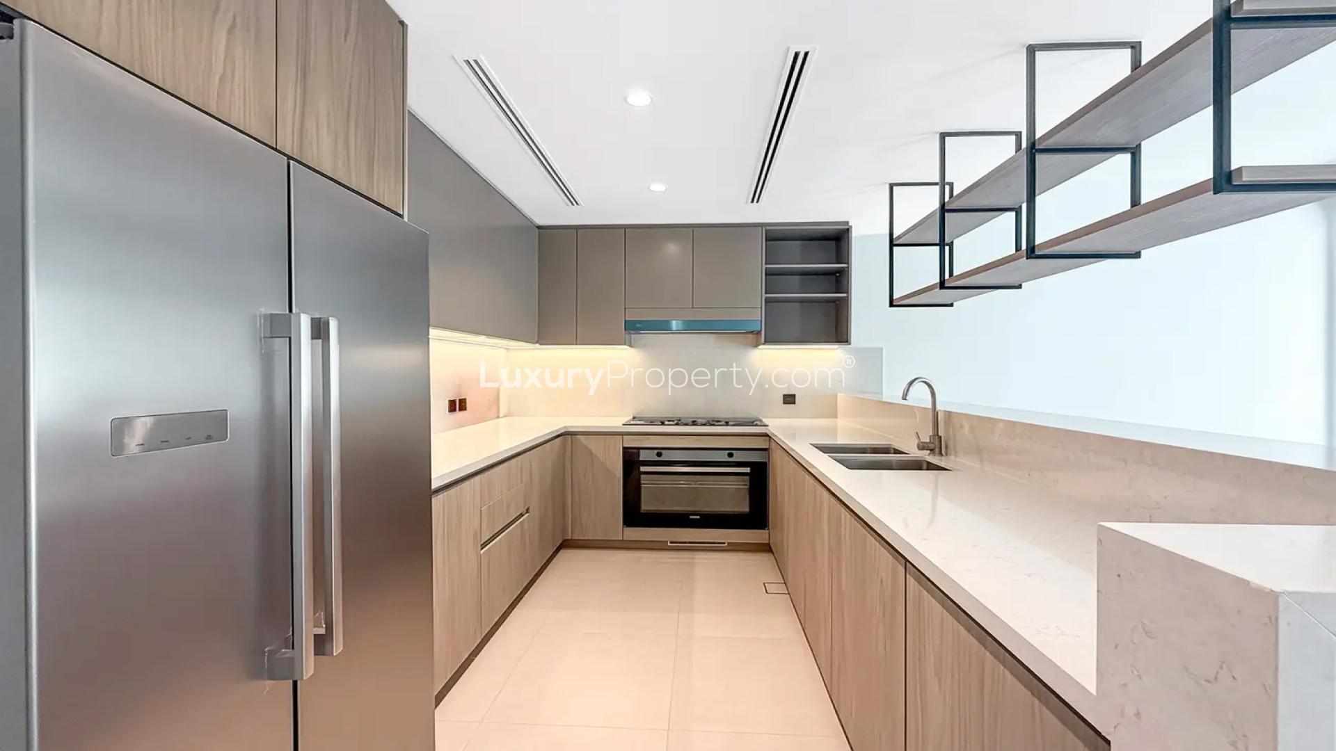 Brand new kitchen and living area in Tilal Al Ghaf Aura Gardens townhouse for rent