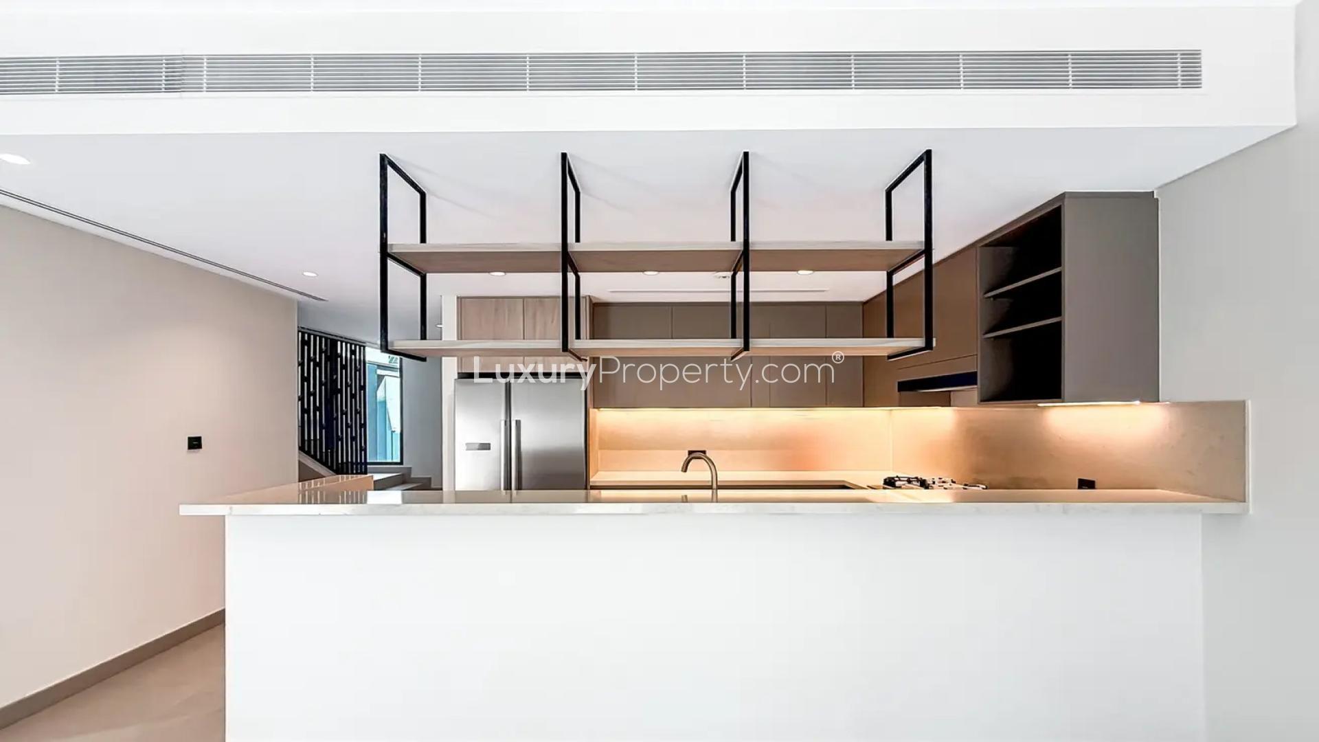 Modern townhouse staircase with glass railing in Aura Gardens, Tilal Al Ghaf